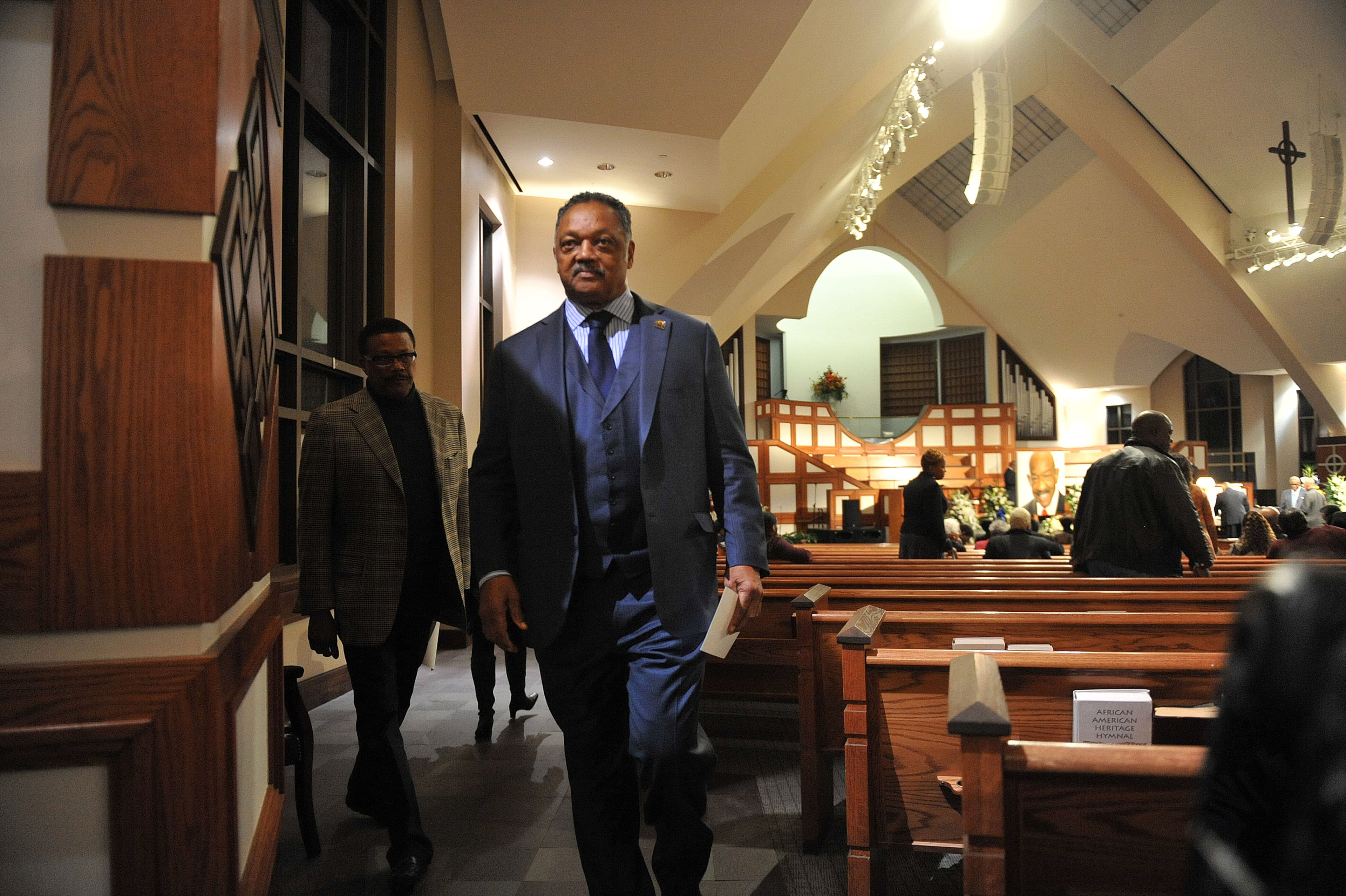 Jackson attends the wake for Atlanta builder and civil rights leader Herman J. Russell at Ebenezer Baptist Church Friday, Nov. 21, 2014. (Kent D. Johnson/AJC)