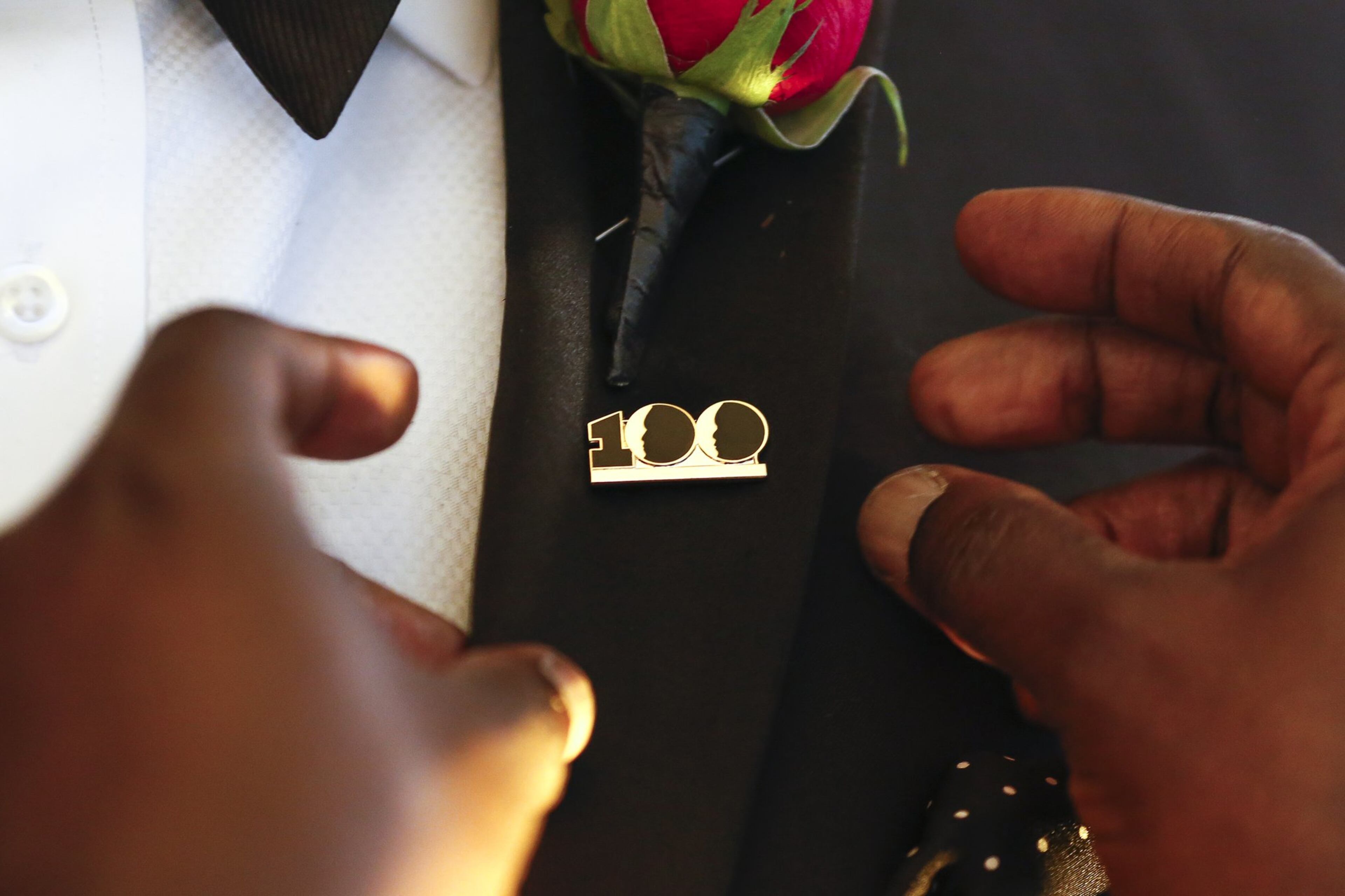 A new member is pinned by an existing member during the induction ceremony Dec. 2 at the 100 Black Men of Atlanta 2018 Gala held at Bentley Atlanta in Alpharetta. (Casey Sykes for The Atlanta Journal-Constitution)