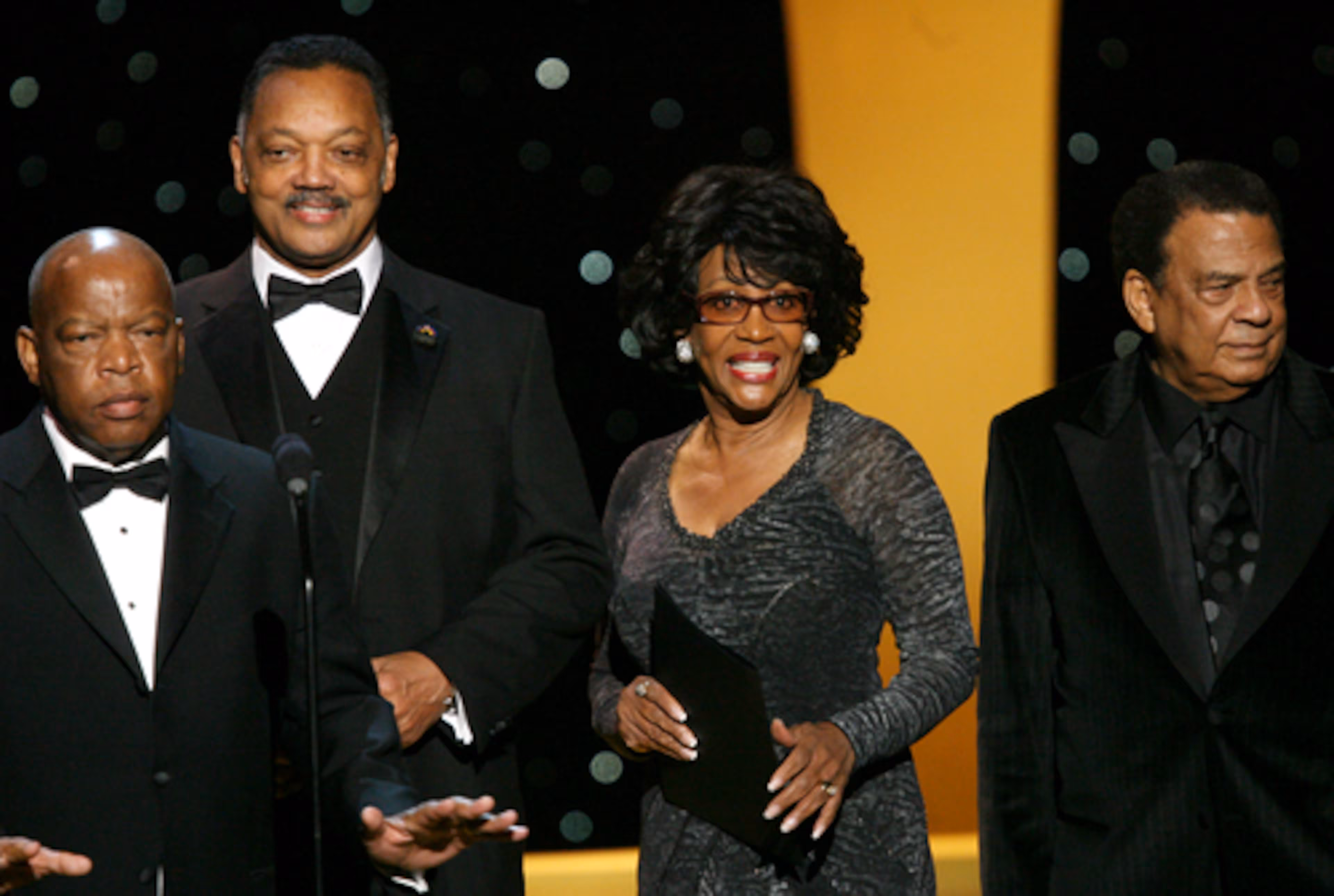(From left) U.S. Rep. John Lewis, Rev. Jesse Jackson, U.S. Rep. Maxine Waters, and Ambassador Andrew Young, take the stage together at the Trumpet Awards. (Jenni Girtman for the AJC)