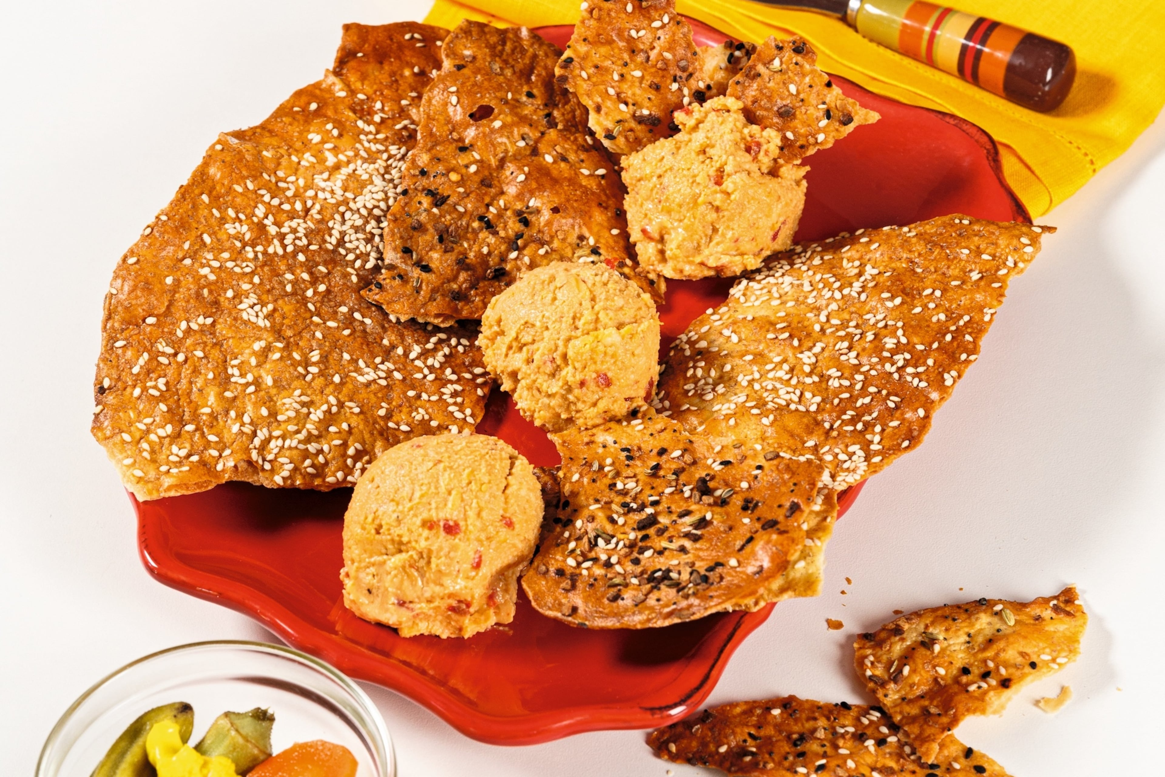 At Southern National, Duane Nutter’s Pimento Cheese is served on a platter with pickled vegetables and sesame flatbread crackers. (Deborah Whitlaw Llewellyn/Courtesy of Gibbs Smith Books)