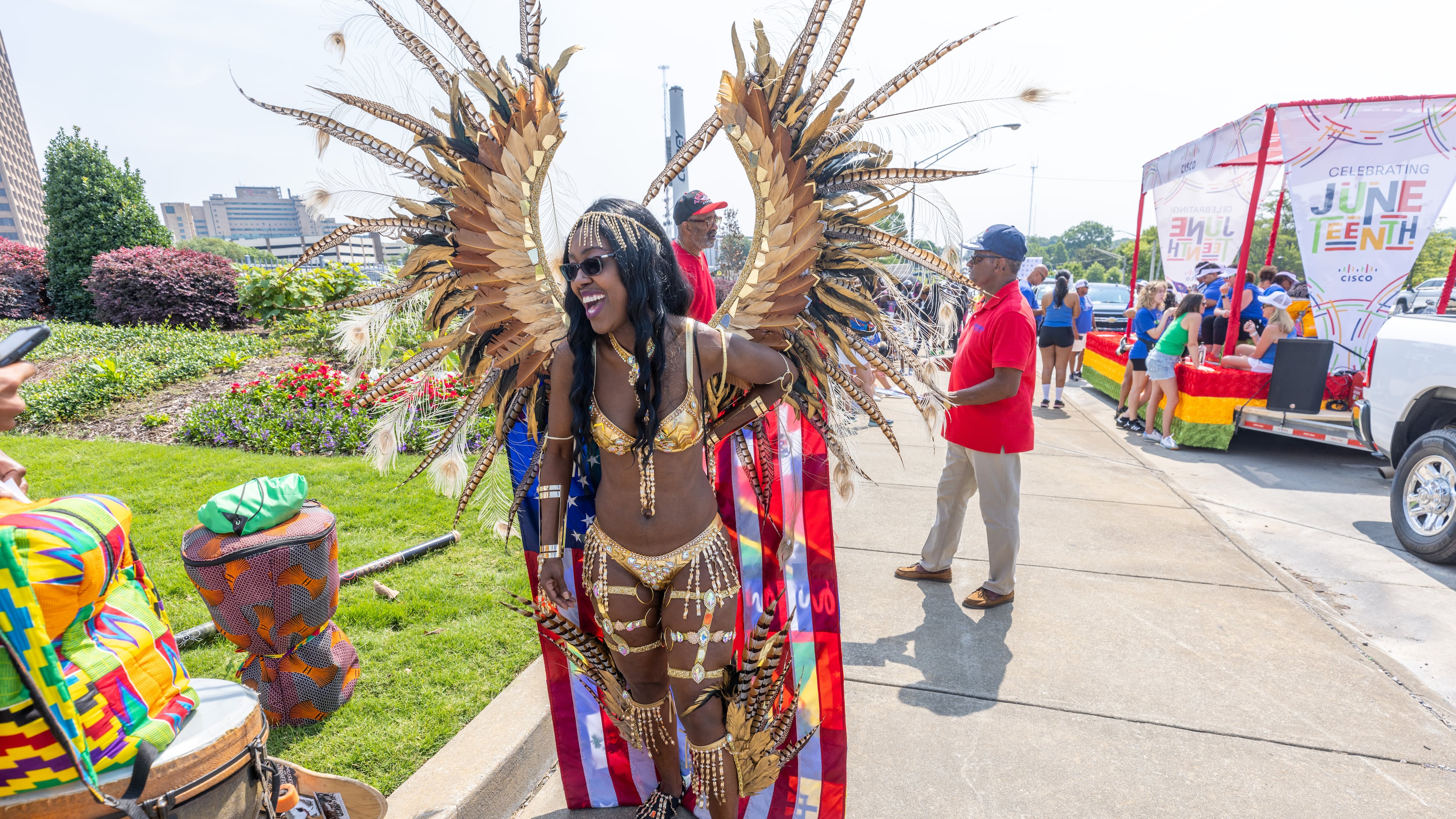 In this 2023 file photo, Nya Brinson waits for the start of the Juneteenth Atlanta Parade and Music Festival. The annual two-day event features handcrafted goods, live performances by local artists and more. (Steve Schaefer/AJC)