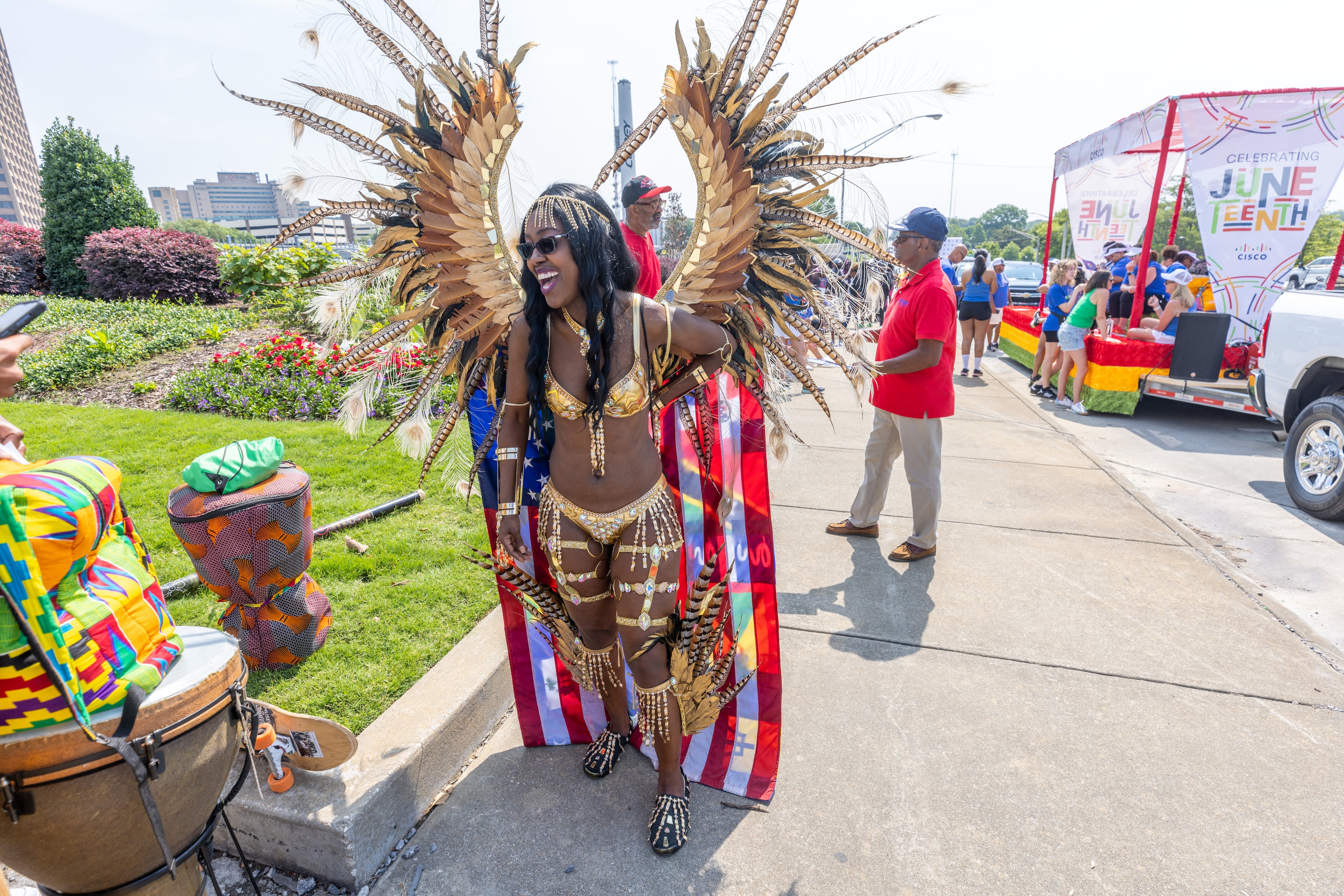 In this 2023 file photo, Nya Brinson waits for the start of the Juneteenth Atlanta Parade and Music Festival. The annual two-day event features handcrafted goods, live performances by local artists and more. (Steve Schaefer/AJC)