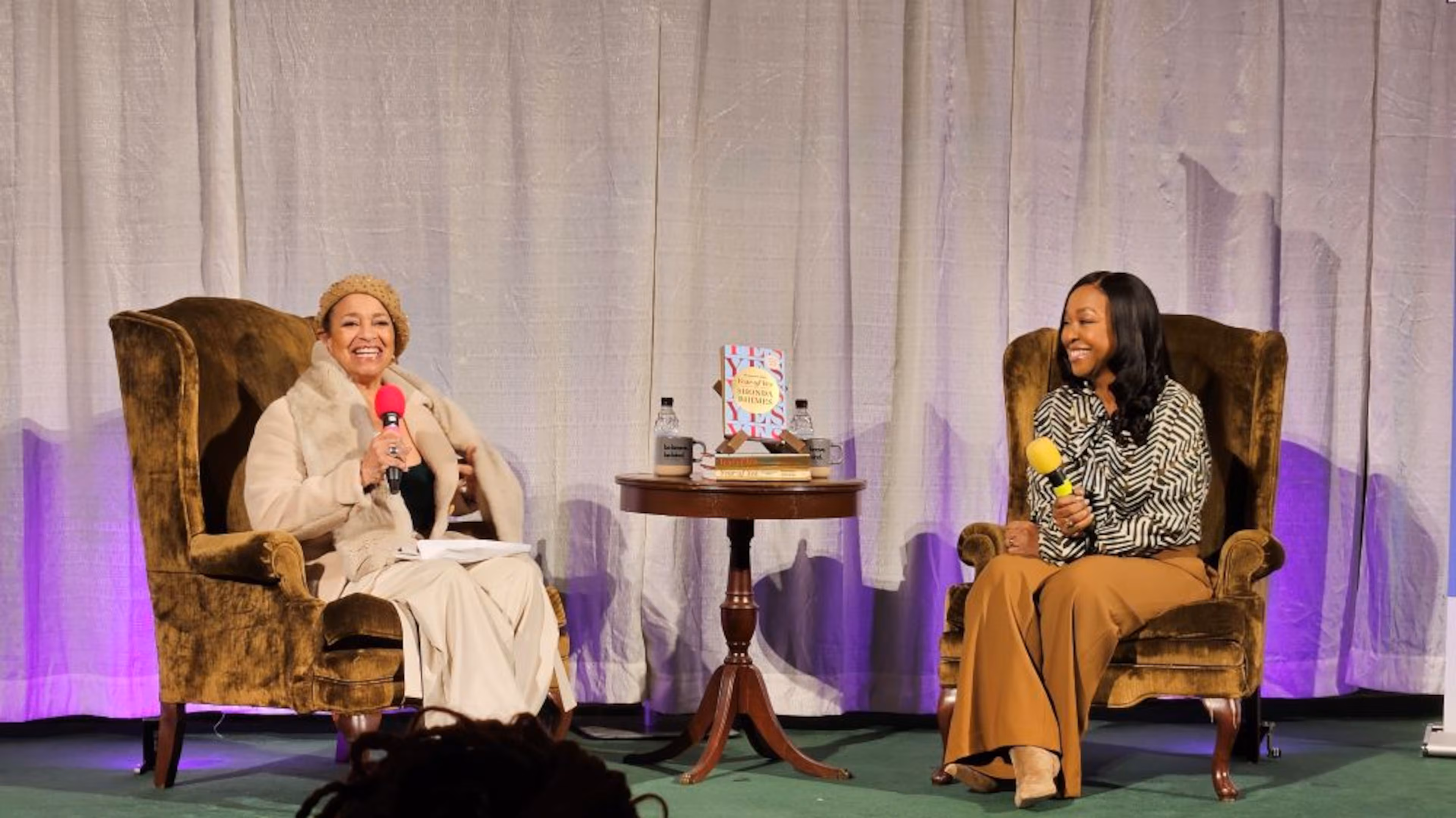 Television writer and executive producer Shonda Rhimes (right) is joined onstage by choreographer and director Debbie Allen (left) for the 10th anniversary 'Year of Yes' book tour at First Baptist Church of Decatur on Thursday, Oct. 23, 2025. (Christopher A. Daniel/AJC)