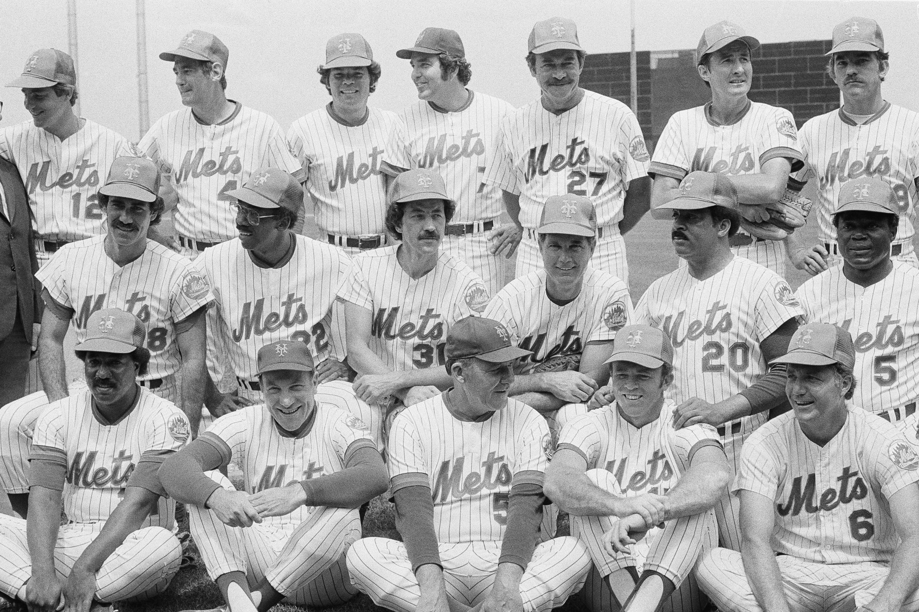 The 1969 New York Mets pose for a 10th anniversary reunion photo at New York's Shea Stadium in 1979. Grambling University's Tommie Agee, who made two impressive defensive plays in center field to help preserve a Mets victory in Game 3 of the World Series, is second from right in the middle row. Morehouse College's Donn Clendenon, who was named 1969 World Series MVP, is second from the left in the middle row. (Bob Schutz/AP 1979)
