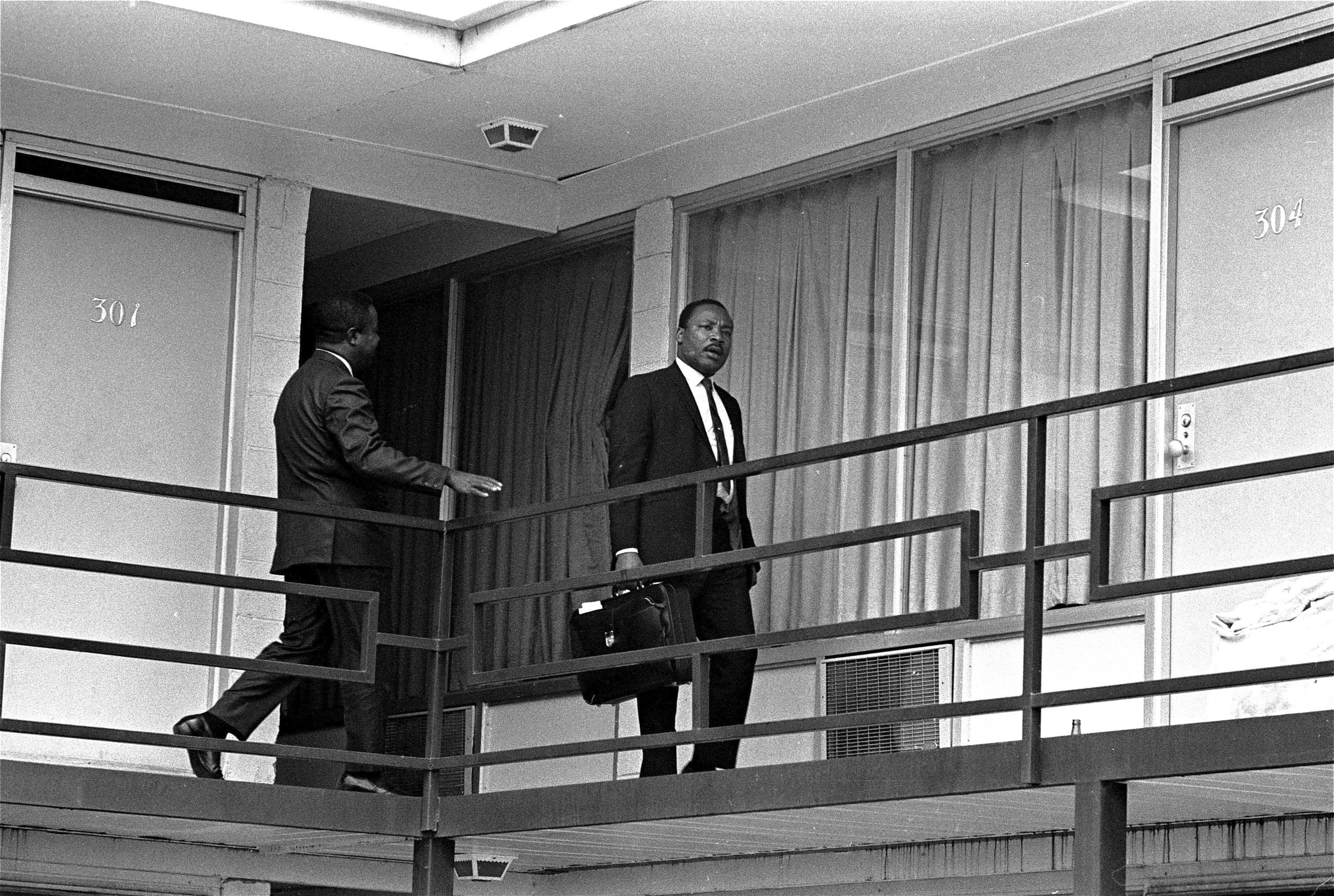 Rev. Martin Luther King, Jr. walks across the balcony of the Lorraine Motel in Memphis, April 3, 1968. (AP Photo/Charles Kelly)