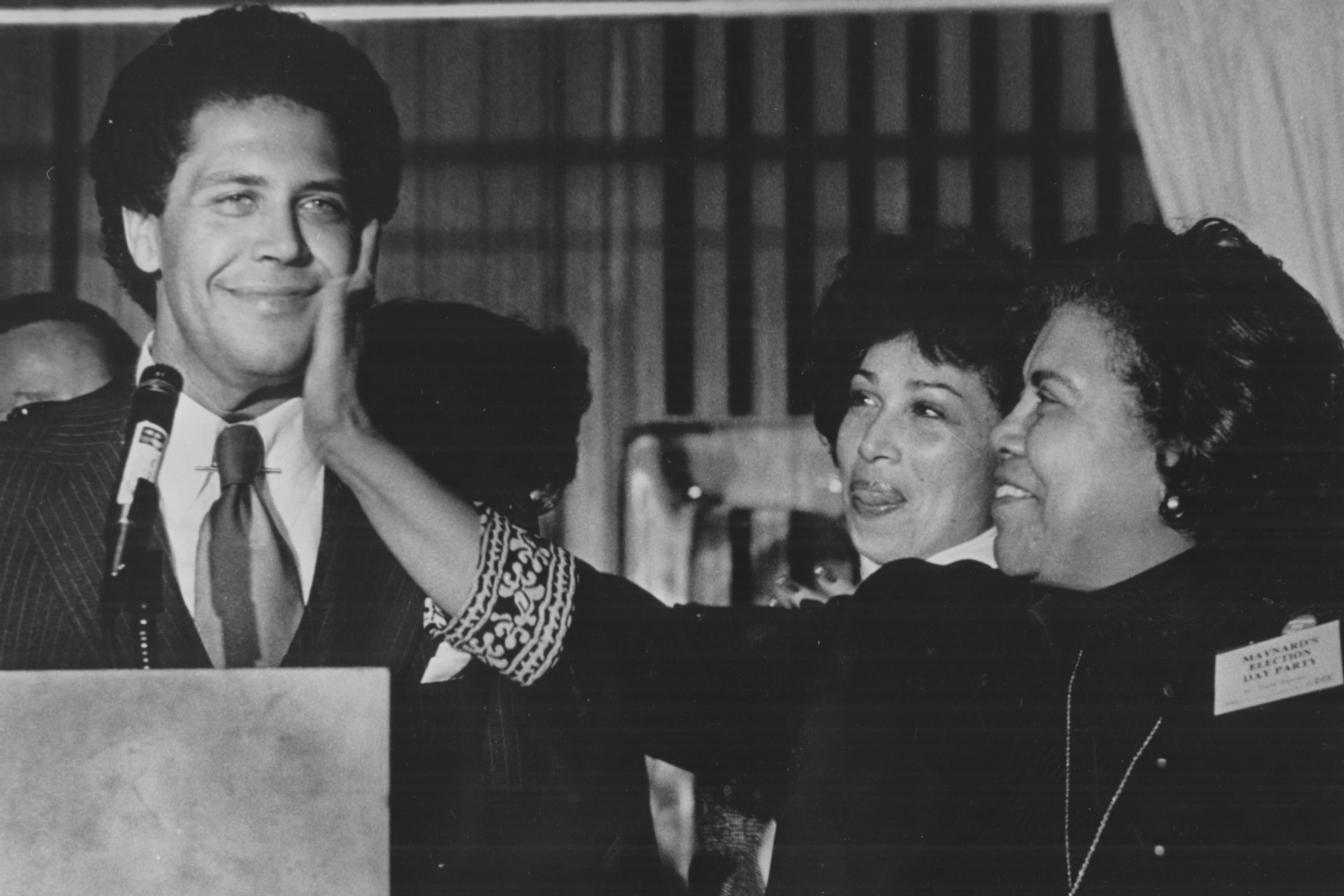 Maynard Jackson, Atlanta's first Black mayor, receives a love pat on the face from his mother. (AJC FILE)