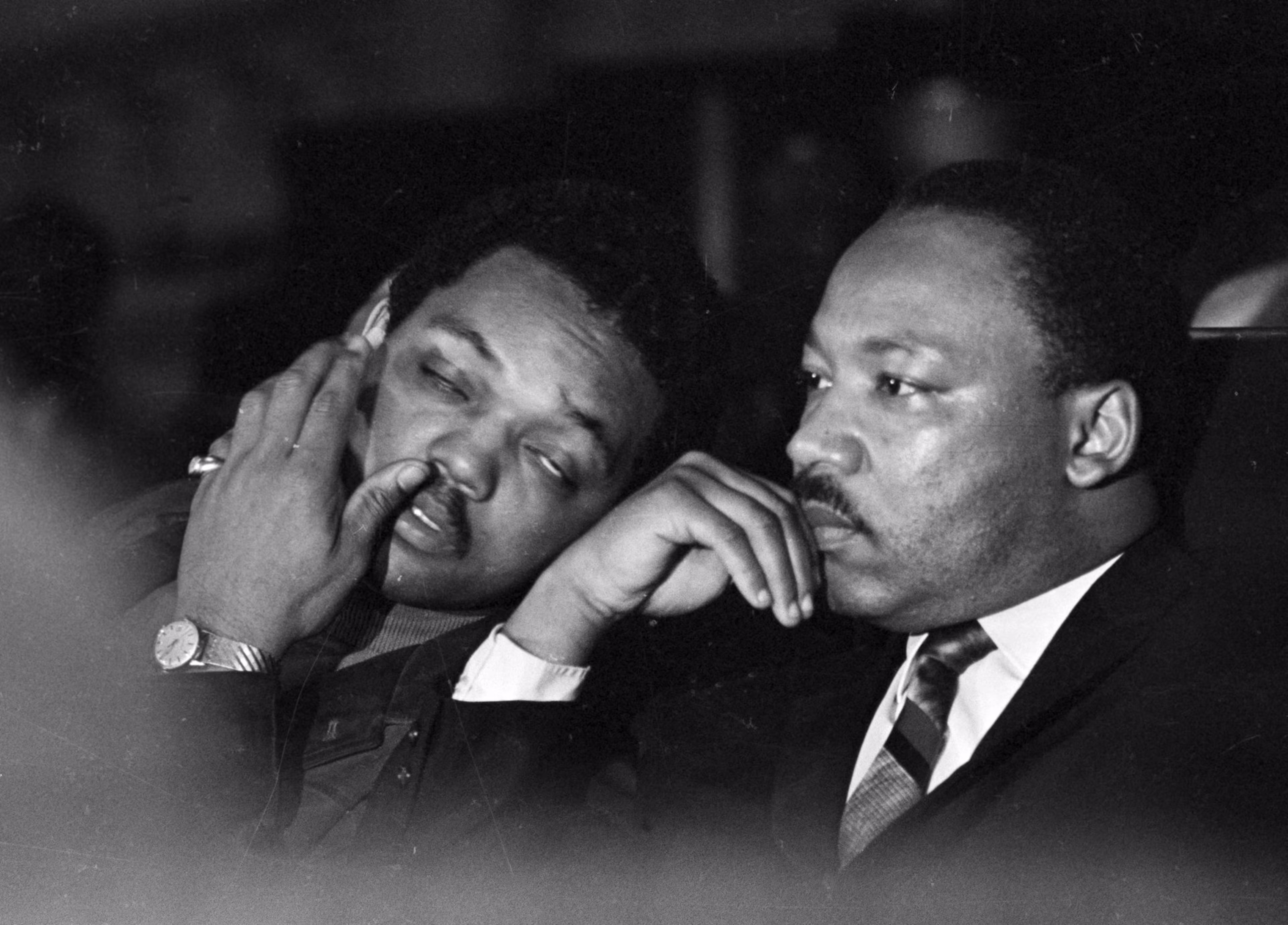 The Rev. Jesse Jackson (left) sits with the Rev. Martin Luther King Jr. before his final public appearance to address striking Memphis sanitation workers on April 4, 1968. King was assassinated later that day outside his motel room. (Charles Kelly/AP)