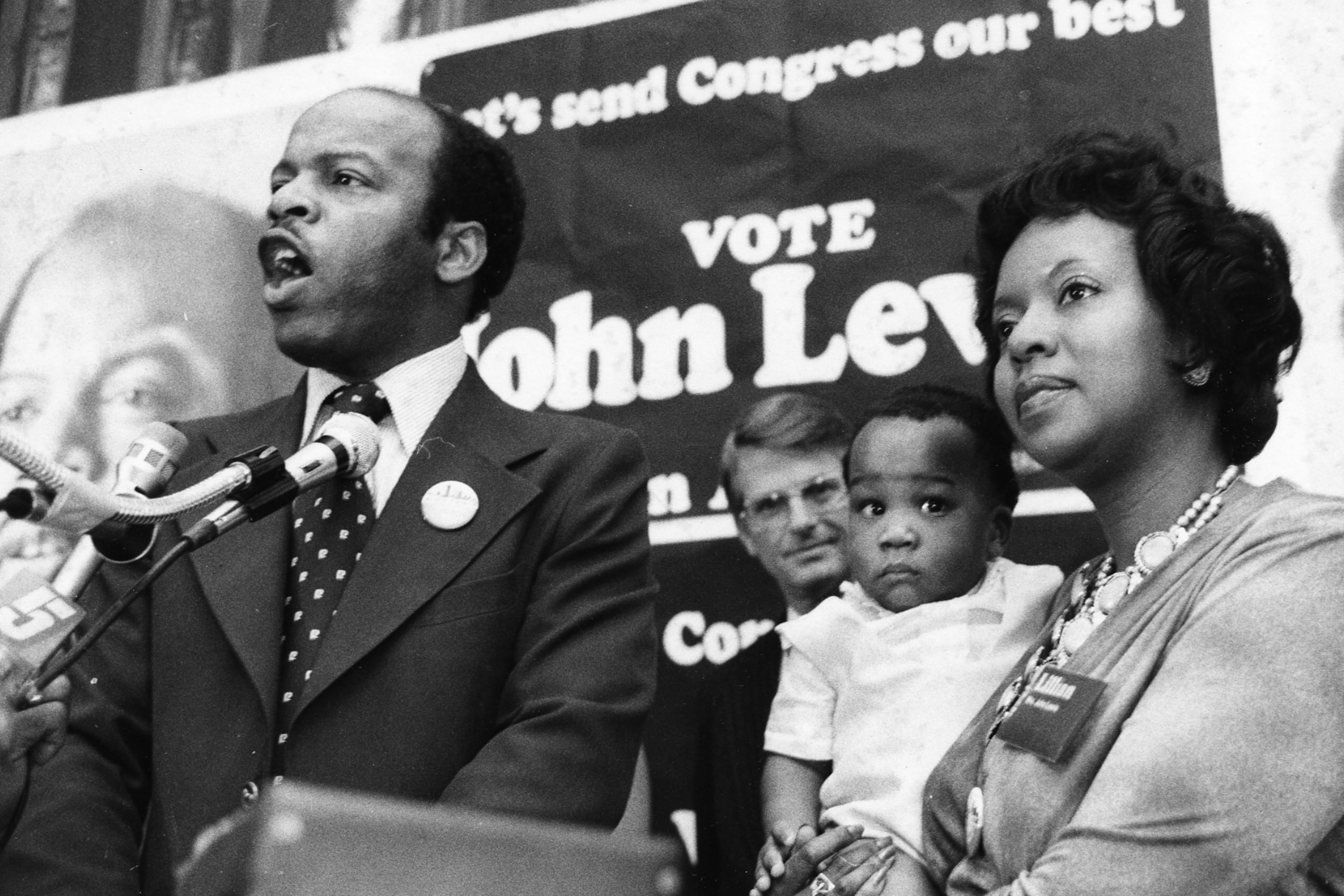 In this photo, John Lewis is joined at a campaign rally by his wife, Lillian, and son, John-Miles, with Zell Miller in the background. (Dwight Ross Jr./AJC file)