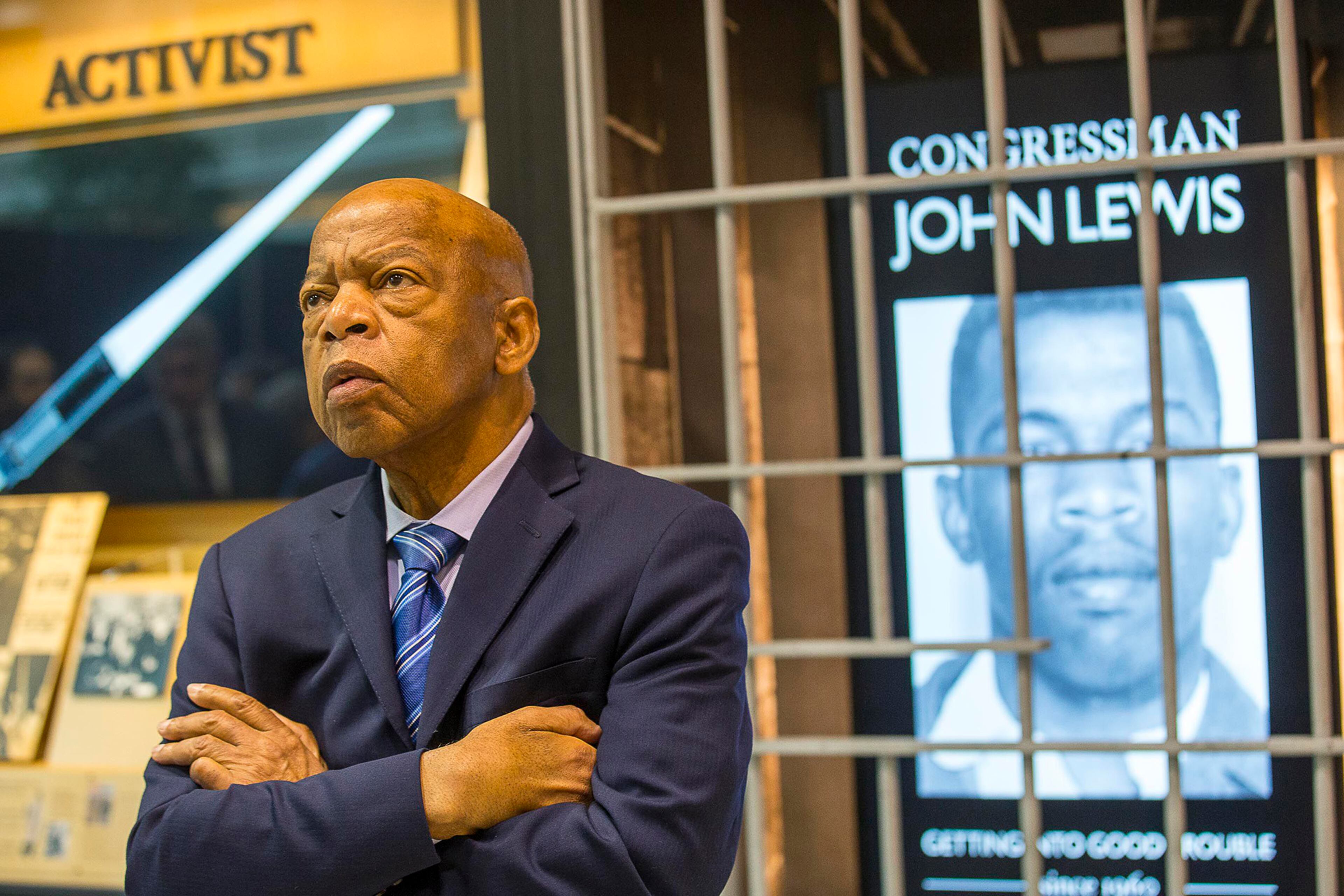 The late U.S. Congressman John Lewis, D-Ga., poses for a portrait in front of his newly unveiled art exhibit "John Lewis-Good Trouble" in the atrium of the domestic terminal at Atlanta's Hartsfield Jackson International Airport, on April 8, 2019. (Alyssa Pointer/Atlanta Journal-Constitution/TNS)