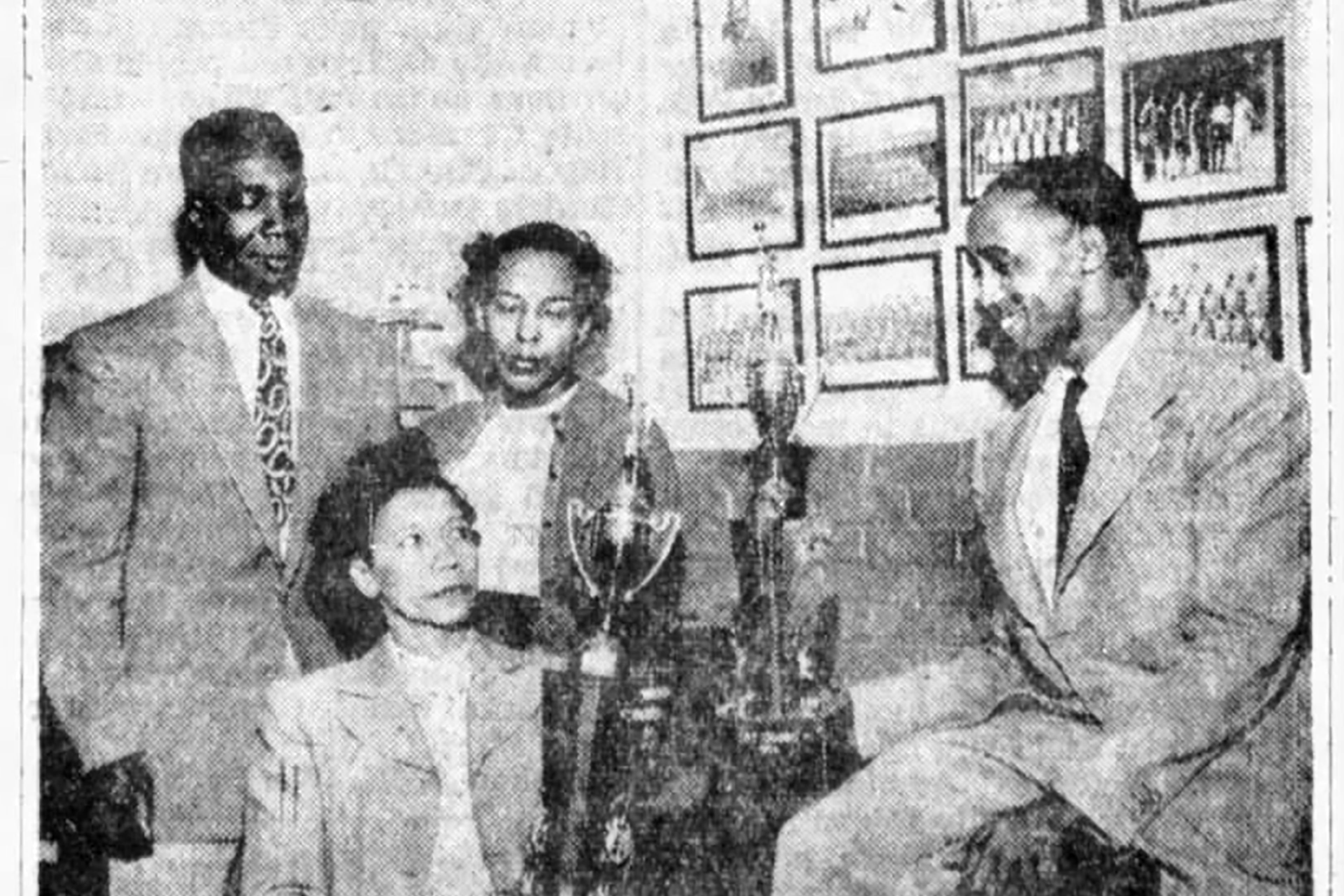 In this clipping from the Atlanta Daily World newspaper, Almeta Hill (bottom left) is shown as coach of the girls basketball team at David T. Howard High School, a Black high school in Atlanta, in 1954. Marian Perkins (top center) was an assistant coach. (Atlanta Daily World/Newspapers.com)