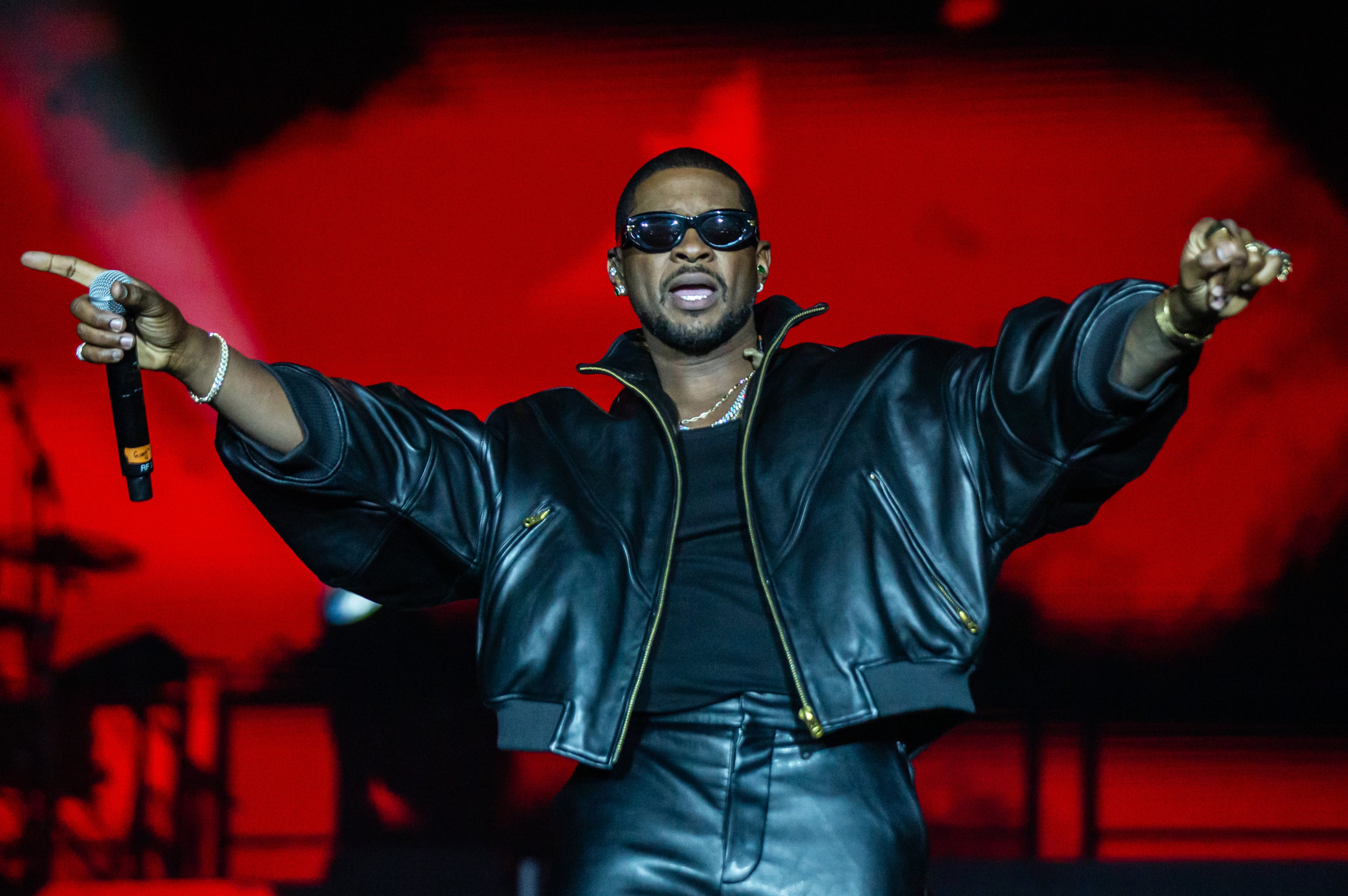 Atlanta singer Usher performs at Piedmont Park in October. He is suing music producer Bryan-Michael Cox and others over a failed Buckhead restaurant deal. (Ryan Fleisher for the AJC)