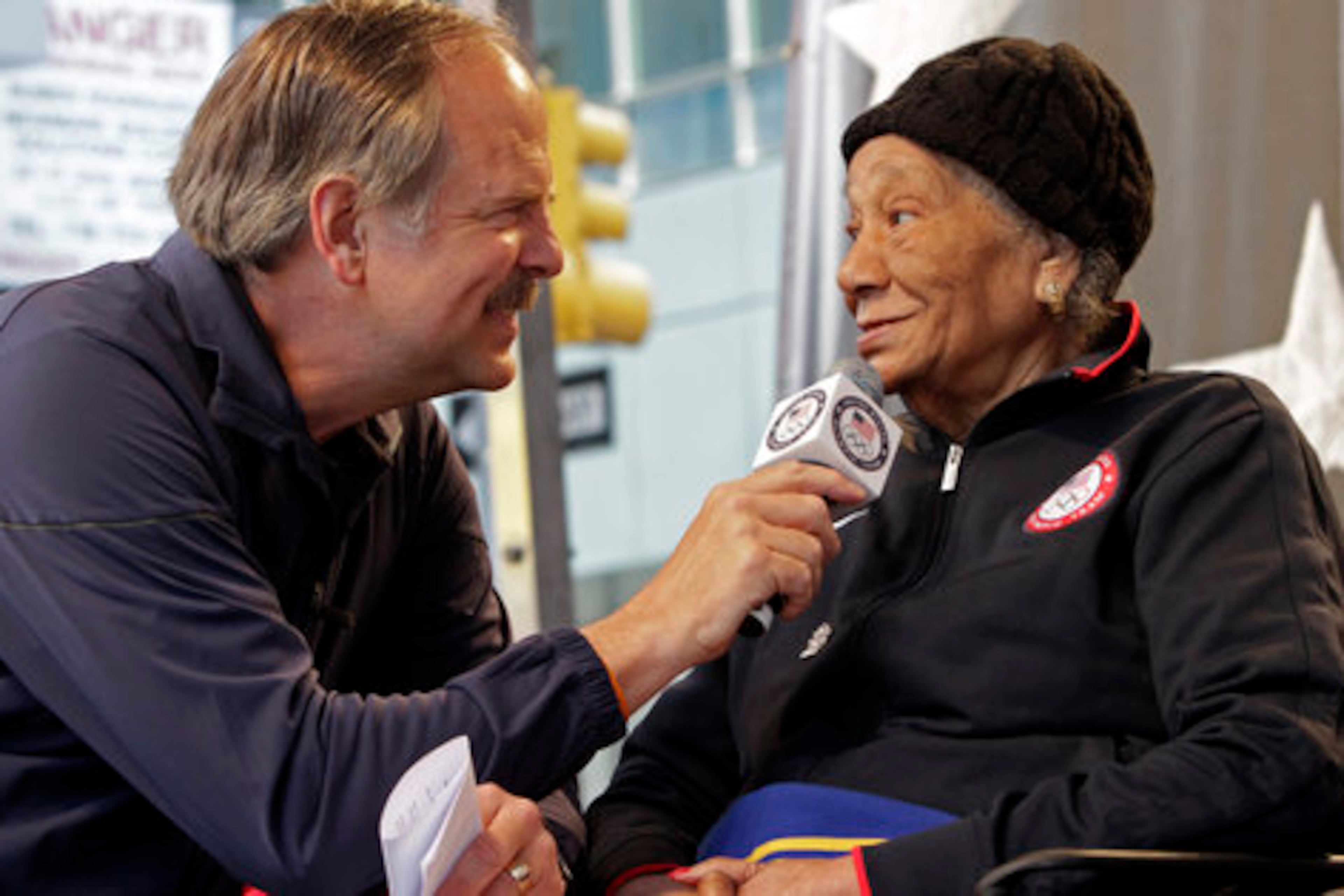 Georgia's Alice Coachman Davis (right), who won became the first Black woman to win an Olympic gold medal after winning the high jump at the 1948 Games, is interviewed in New York in 2012. (Bebeto Matthews/AP 2012)