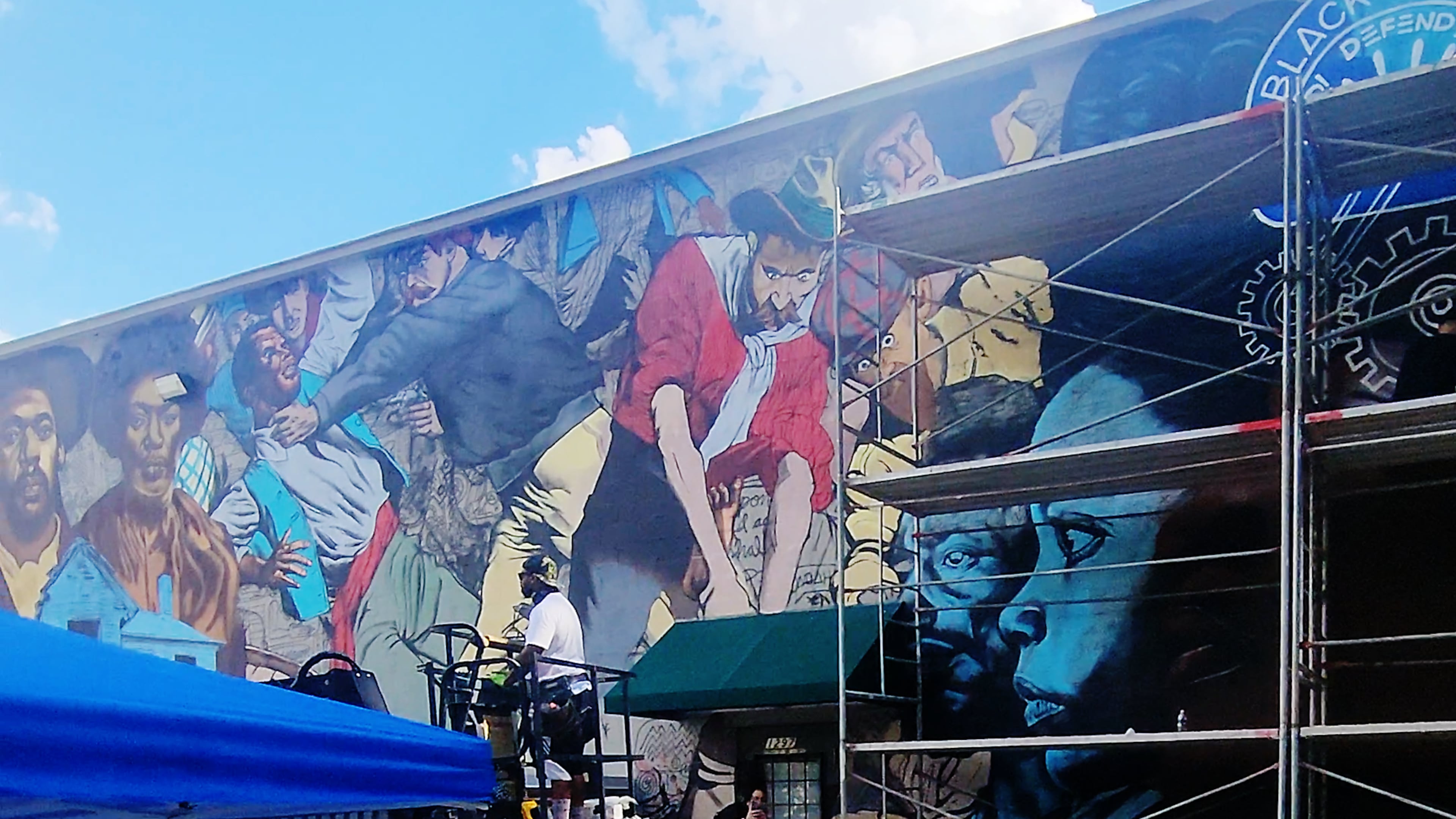 The mural at Focused Community Strategies is a reminder of the 1906 Atlanta Race Massacre. (Courtesy of the National Center of Civil and Human Rights)