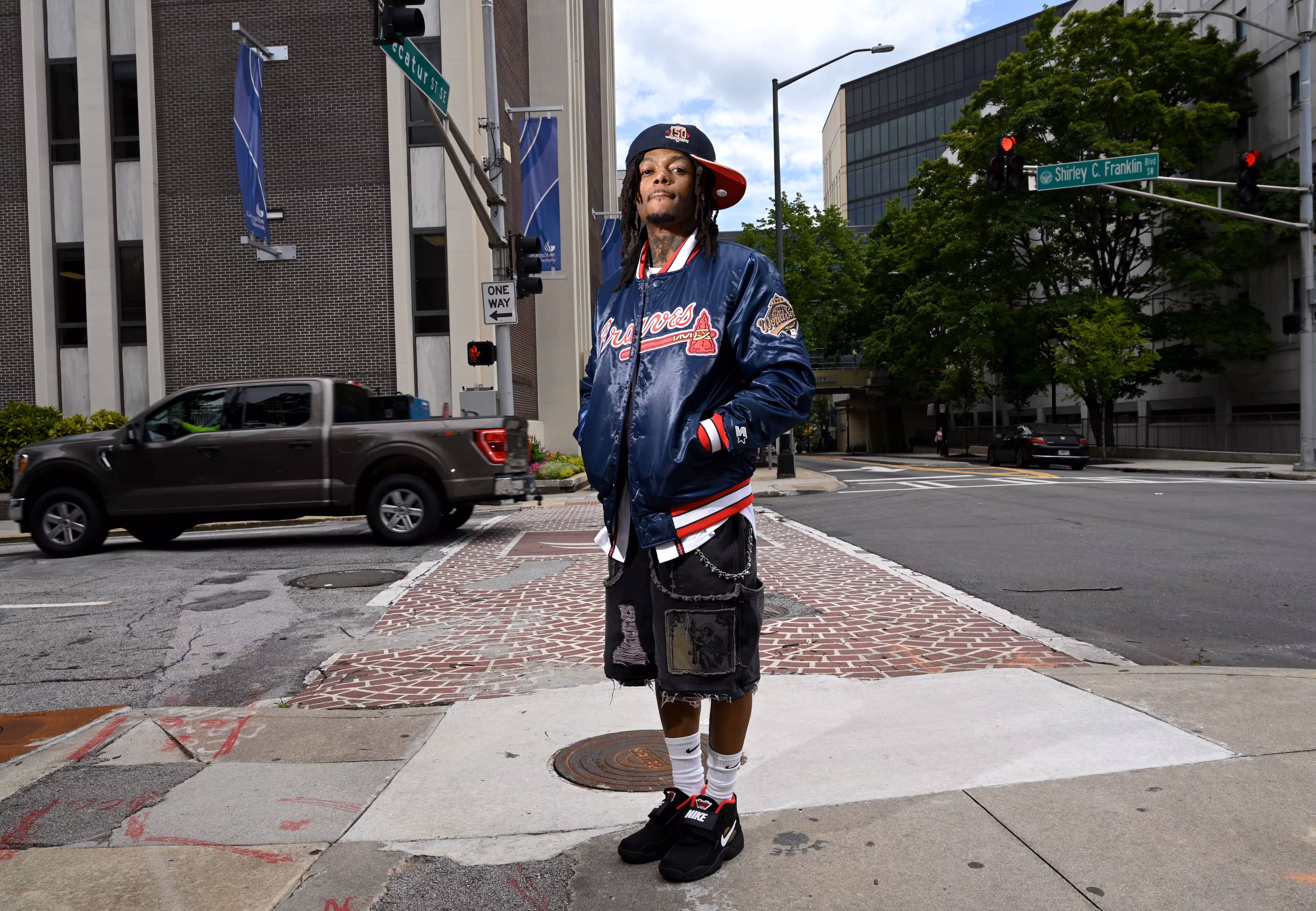 Atlanta-born rapper JID poses for a photo at Walter's Clothing Store in downtown Atlanta, Tuesday, July 1, 2025. (Hyosub Shin/AJC)