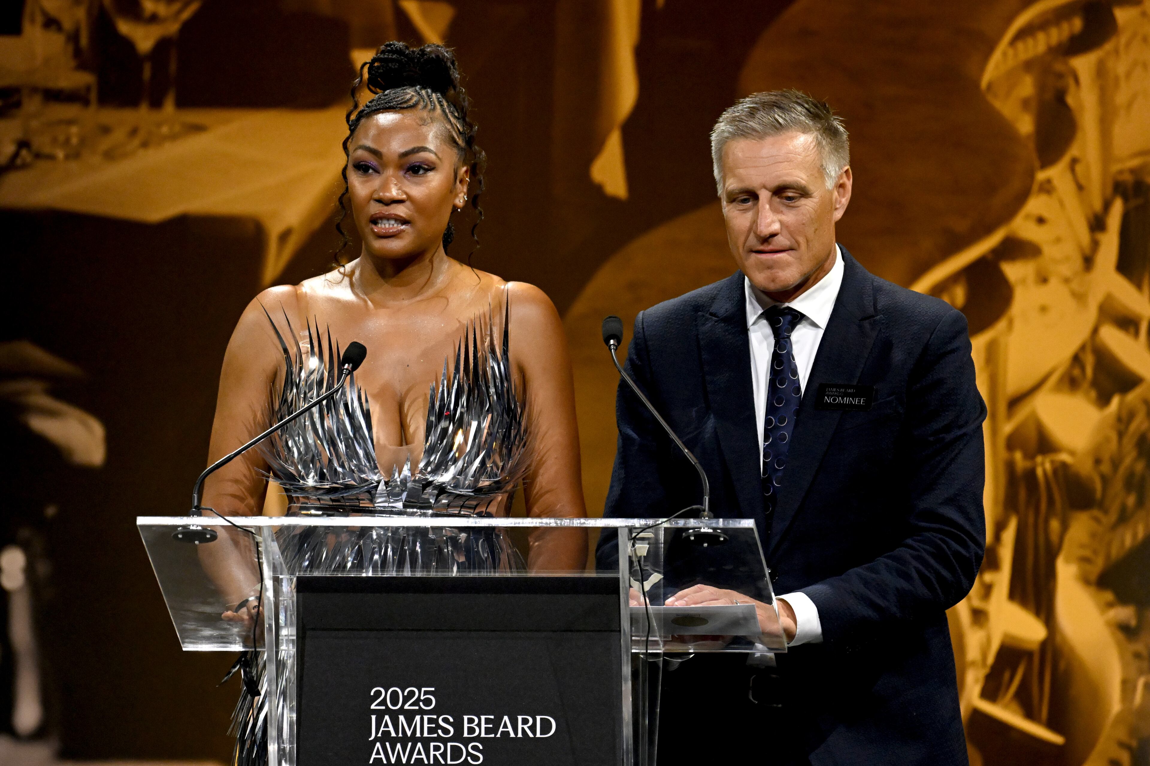 Tahiirah Habibi and Bobby Stuckey speak on stage during the 2025 James Beard Restaurant and Chef Awards on June 16, 2025 in Chicago, Illinois. (Photo by Daniel Boczarski/Getty Images for James Beard Foundation)