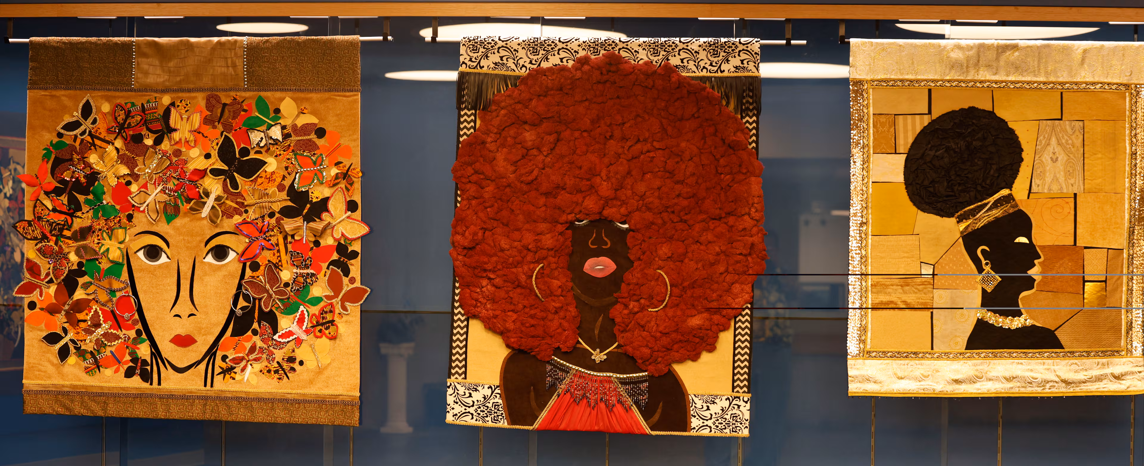 Art pieces consisting of fabric collage with textiles and acrylics are a part of the opening reception of artist J. Stacey Grayson art exhibition at the Fulton County Central Library. Saturday, November 8, 2025. (Akili-Casundria Ramsess, EyeAkili Media for the AJC)