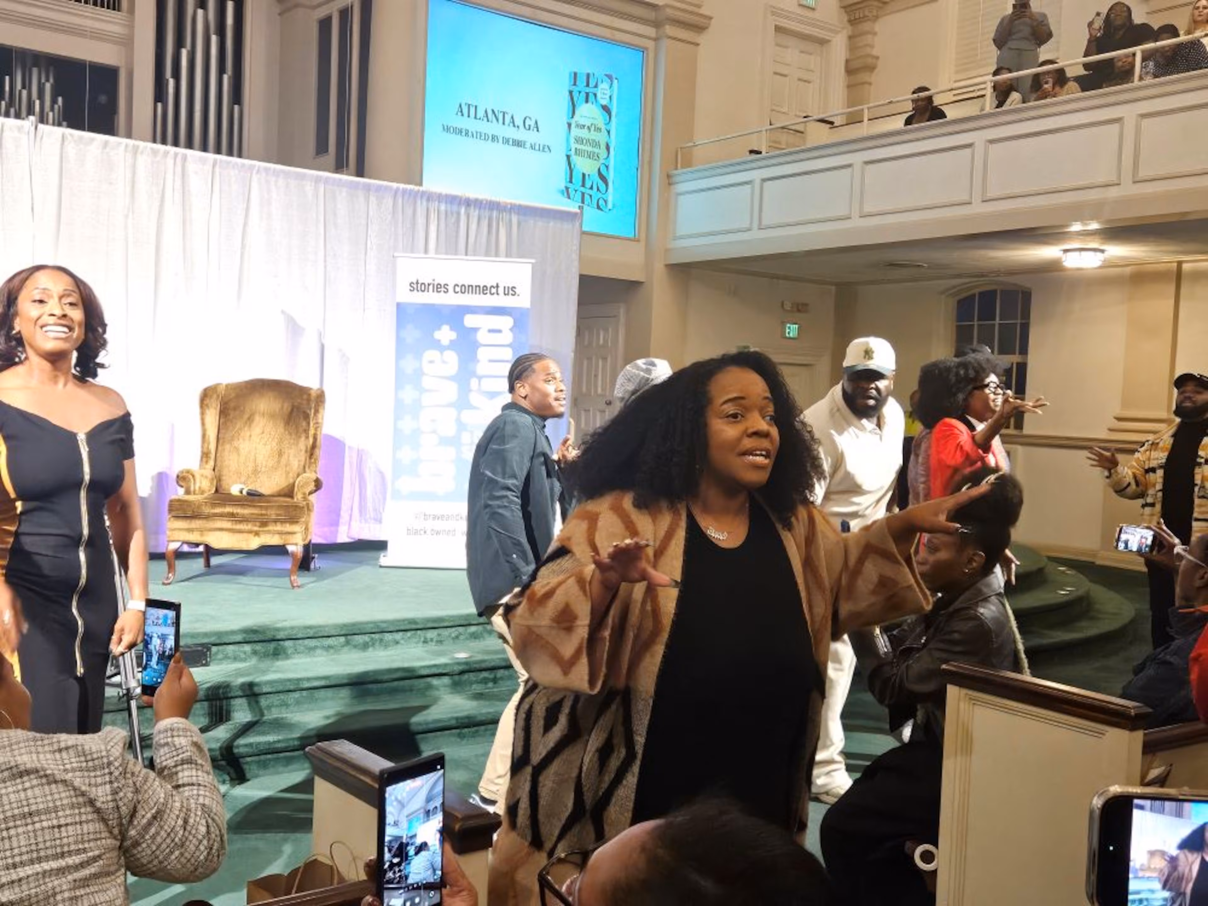 Member of CommUNITY ATL Choir perform singer Bill Withers' 1977 hit 'Lovely Day' during series creator Shonda Rhimes' book tour for 'Year of Yes' at First Baptist Church of Decatur on Thursday, Oct. 23, 2025. (Christopher A. Daniel/AJC)