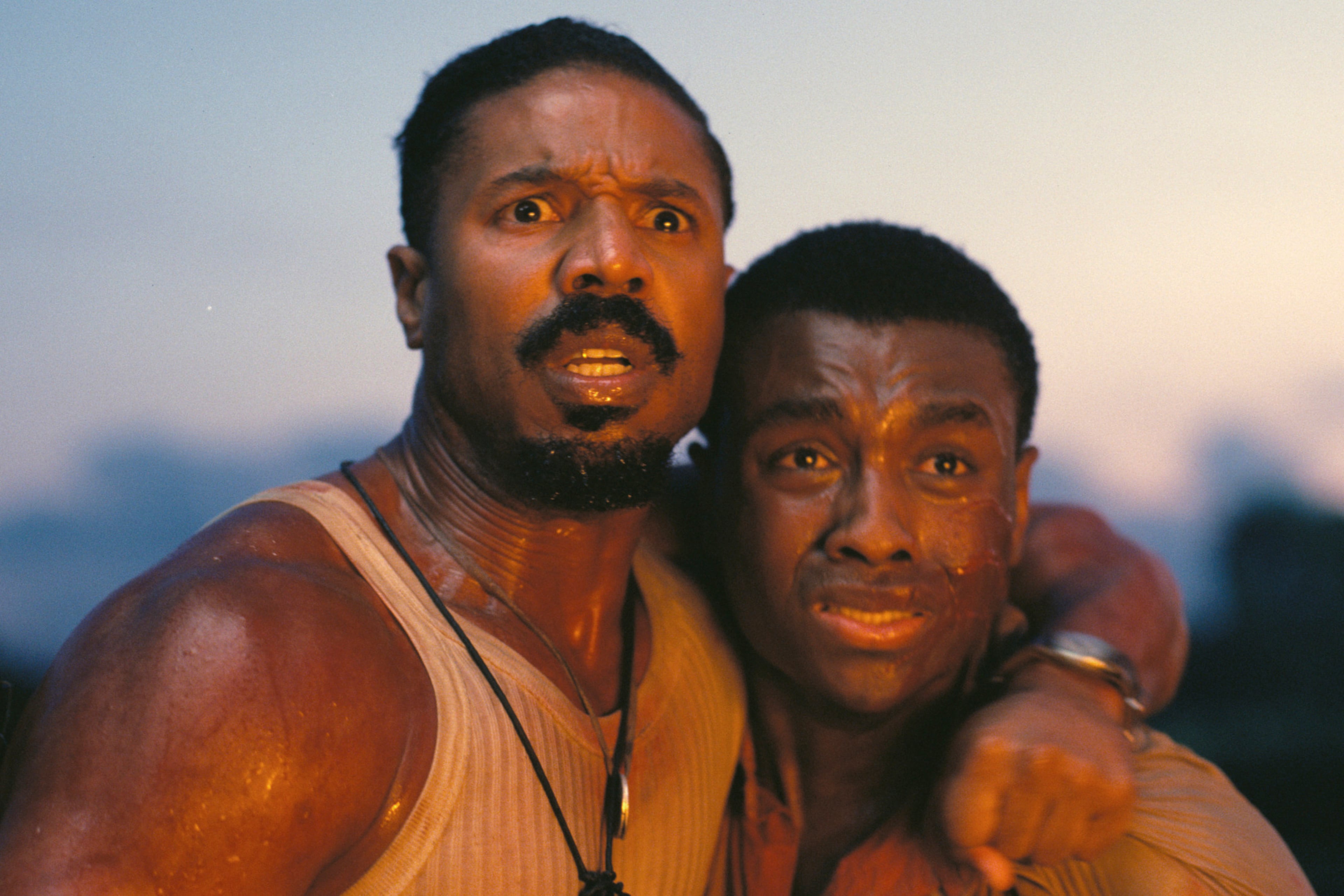 This image released by Warner Bros Pictures shows Michael B. Jordan, left, and Miles Caton in a scene from "Sinners." (Warner Bros. Pictures via AP)