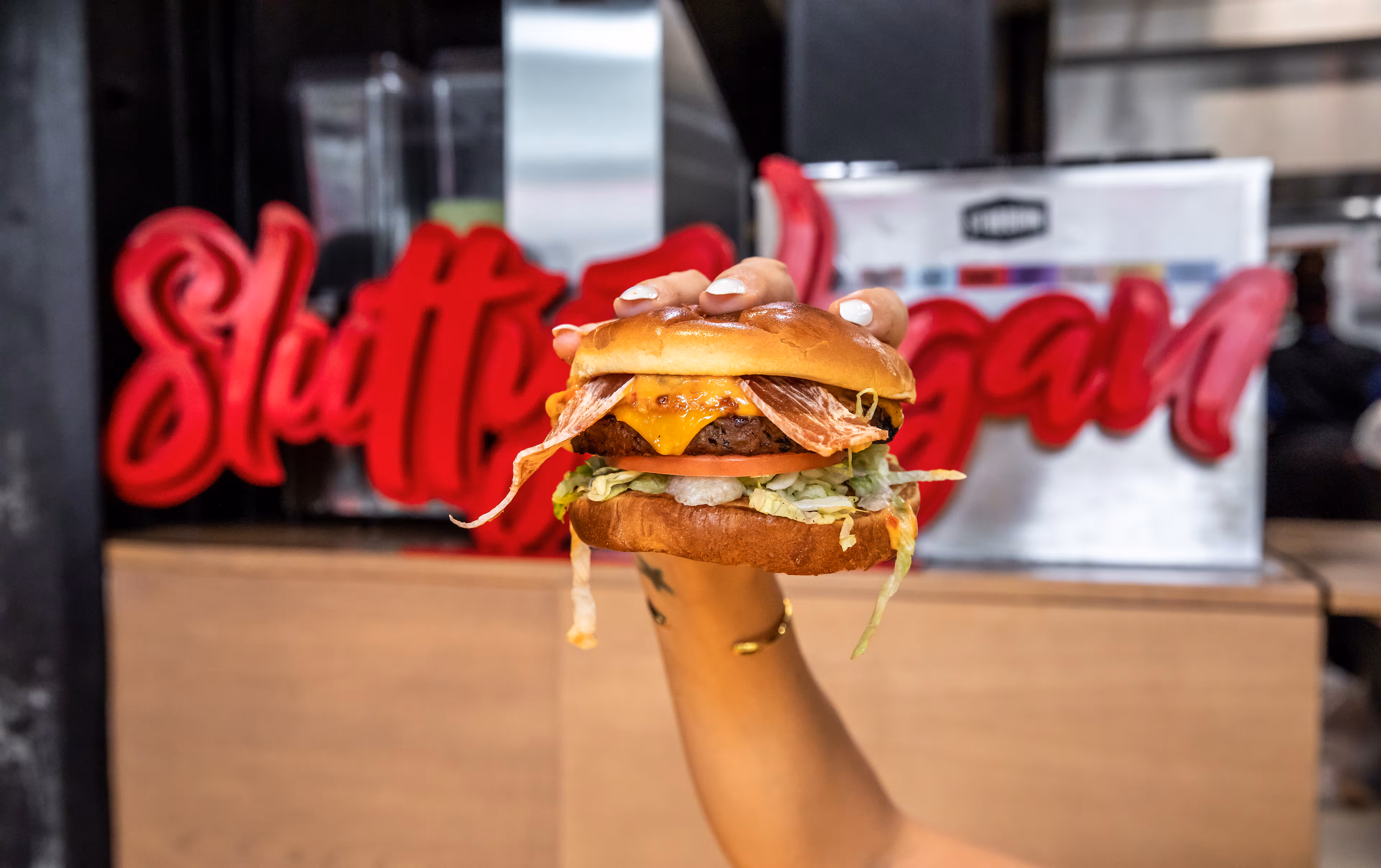 The One Night Stand is a burger loaded with vegan bacon, vegan cheese, caramelized onions, lettuce, tomato and "slut sauce" on a vegan Hawaiian bun. (Courtesy of Madelynne Boykin)