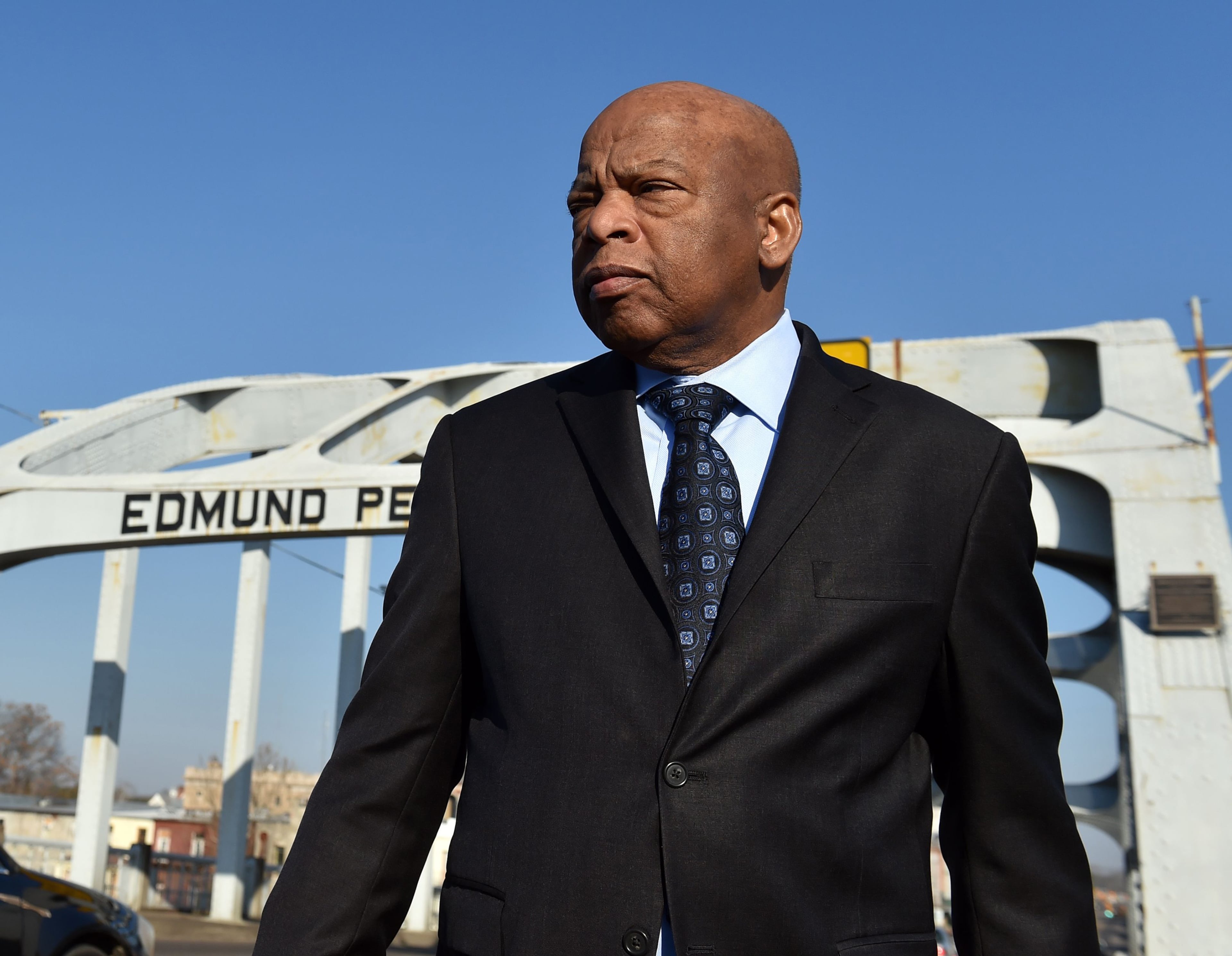 Rep. John Lewis stands on the Edmund Pettus Bridge in February 2015. On March 7, 1965, he helped lead 600 civil rights activists across the bridge in a march for voting rights. The former congressman from Georgia died of cancer in 2020. (AJC 2015)