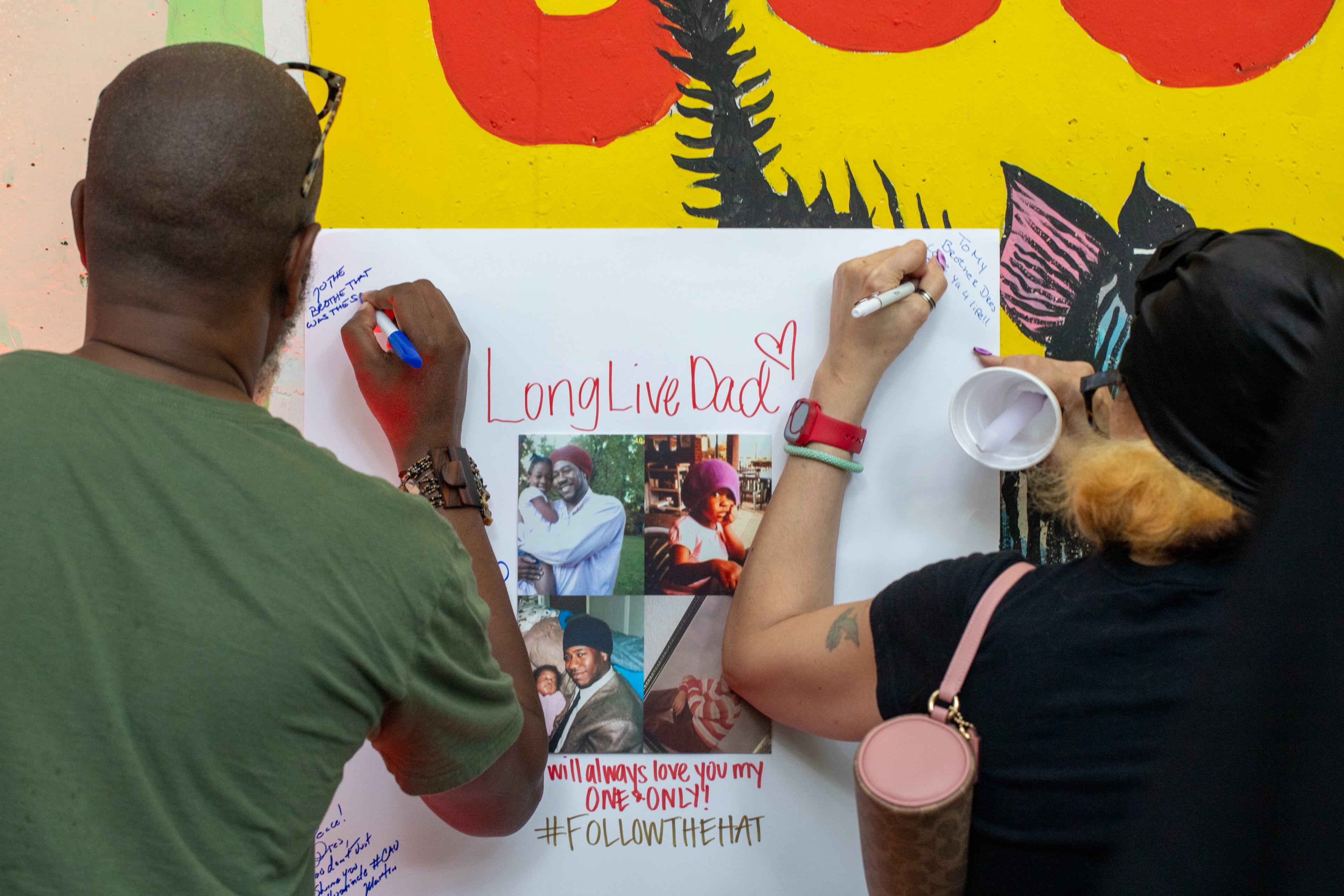 During the vigil for Andre "D.R.E.S. Tha Beatnik" Lett, his daughter asked everyone to leave a message at the remembrance. His family and friends remember a gifted entertainer, someone who was passionate about supporting creatives. (Jenni Girtman for the AJC)