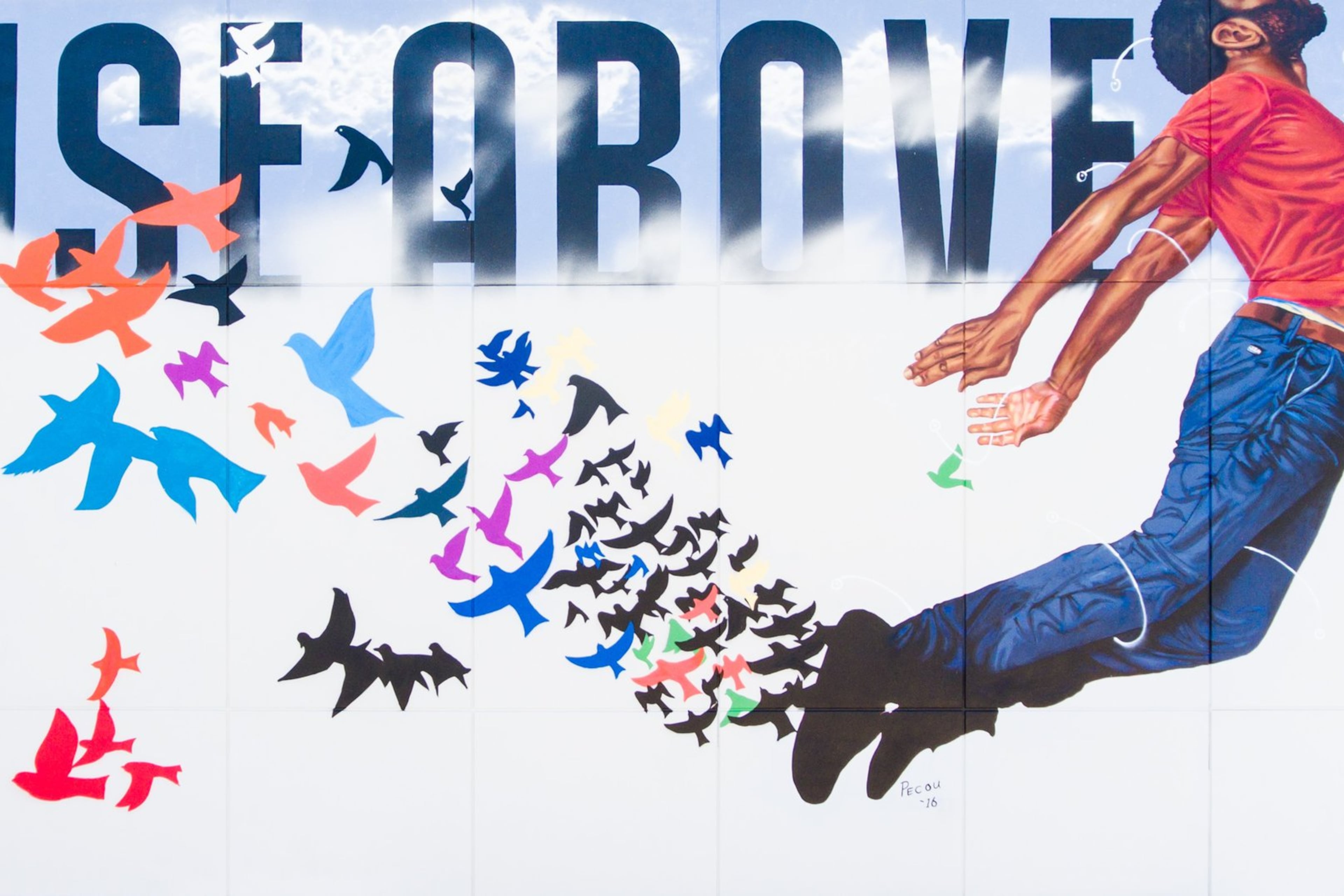 Fahamu Pecou painted “Rise Above” on the side of the King Memorial MARTA station, as a part of the En Route program, an effort by non-profit arts group WonderRoot to give voice to the community. CONTRIBUTED: WONDERROOT