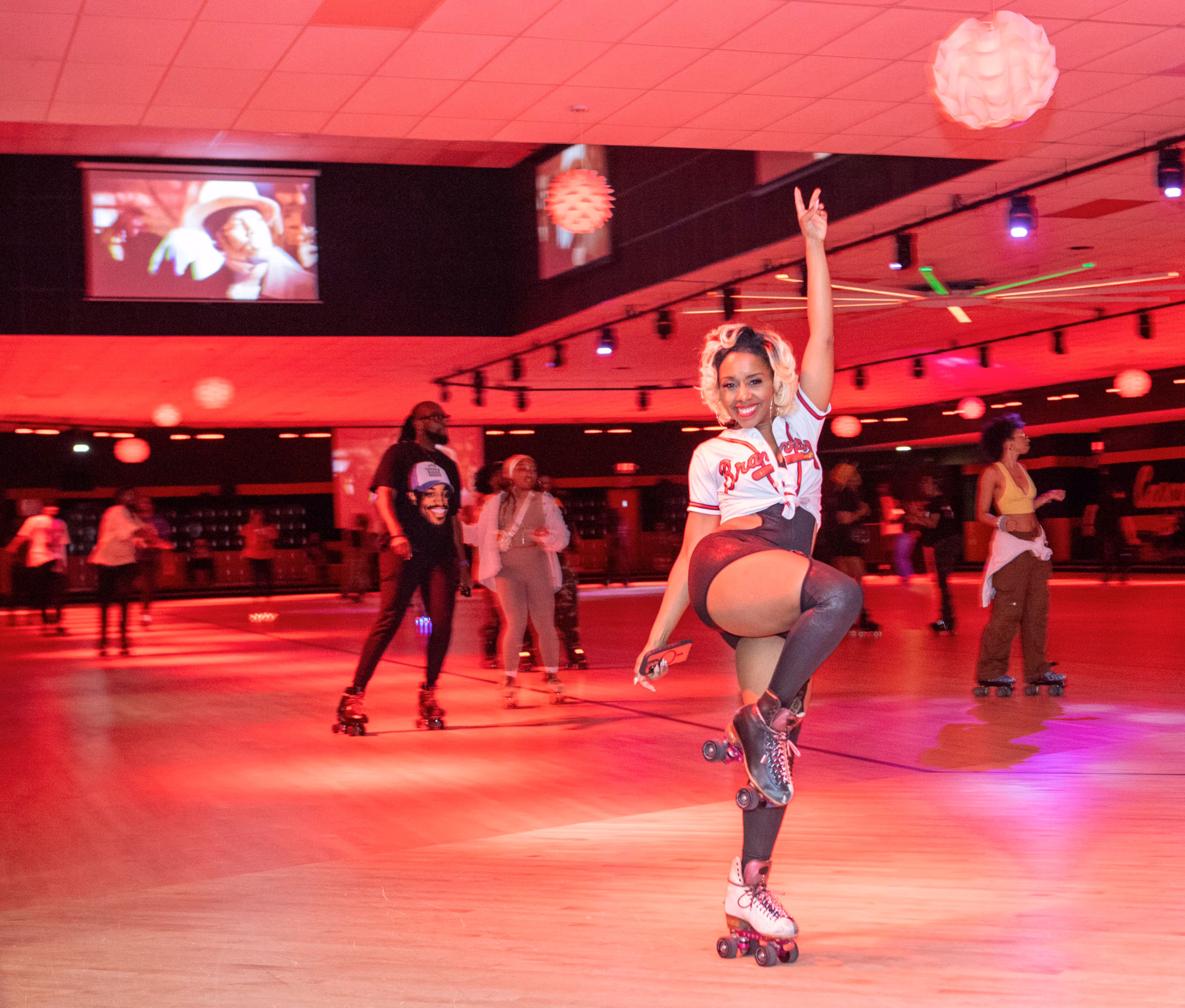 Kamille Gilmore donned skates and enjoyed the celebration of the 25th anniversary of Outkast's "Stankonia" album. (Jenni Girtman for the AJC)