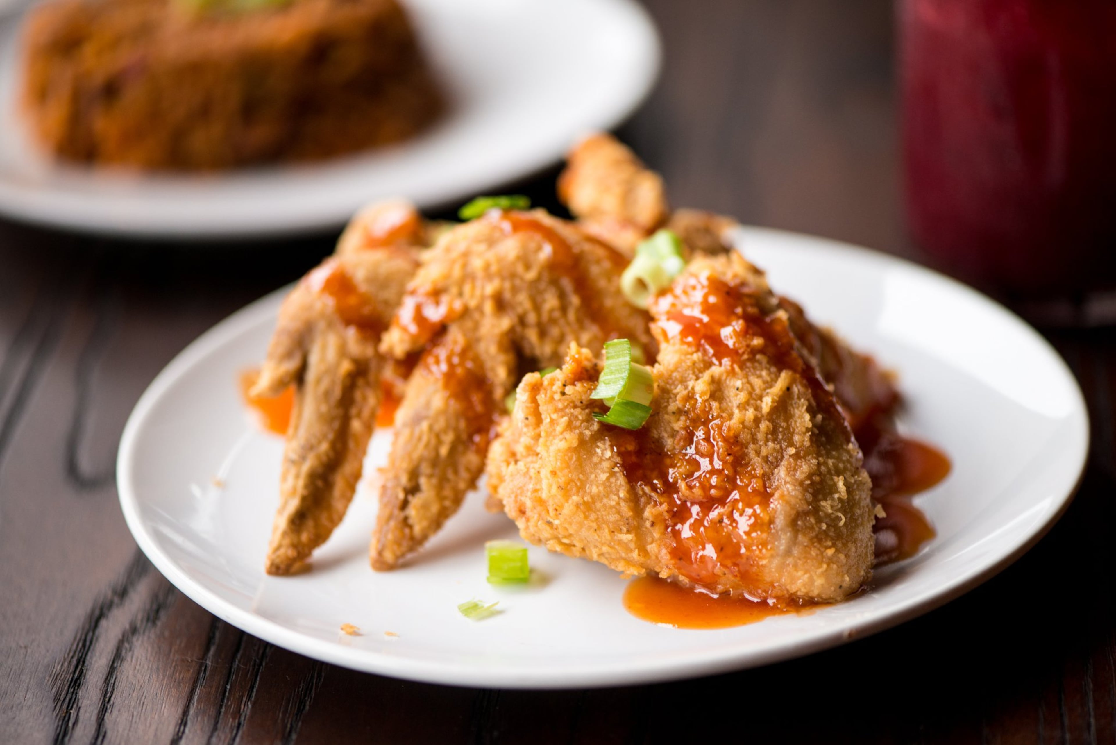Jam Up Wings, seasoned and marinated hot wings drizzled with Gullah Gal sauce, is served fried or baked at Virgil’s Gullah Kitchen and Bar in West Midtown and Conyers. During Black Restaurant Week in Atlanta, which started Sunday, appetizers at Virgil's will be offered free with the purchase of an entree. (Courtesy of Mia Yakel)