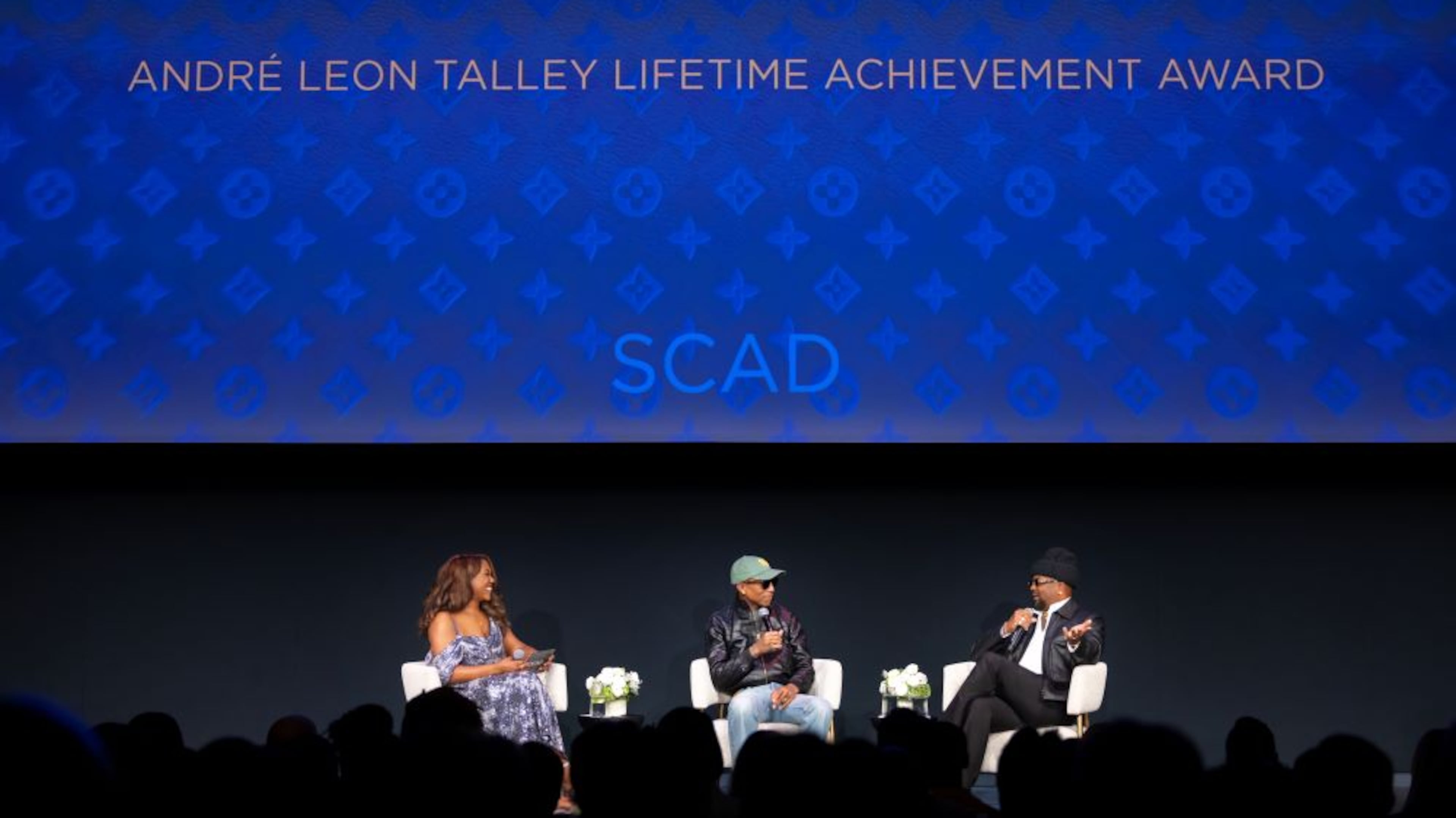 Grammy-winning producer, songwriter and men's creative director for Louis Vuitton Pharrell Williams (middle) sits for a conversation with songwriter/producer The-Dream (right) and YELLOW director of engagement and communications Stephanie Sutton at SCADshow, Atlanta, on Tuesday, Oct. 14, 2025, Williams was receiving the Andre Leon Talley Lifetime Achievement Award from SCAD. (Courtesy of SCAD Atlanta)