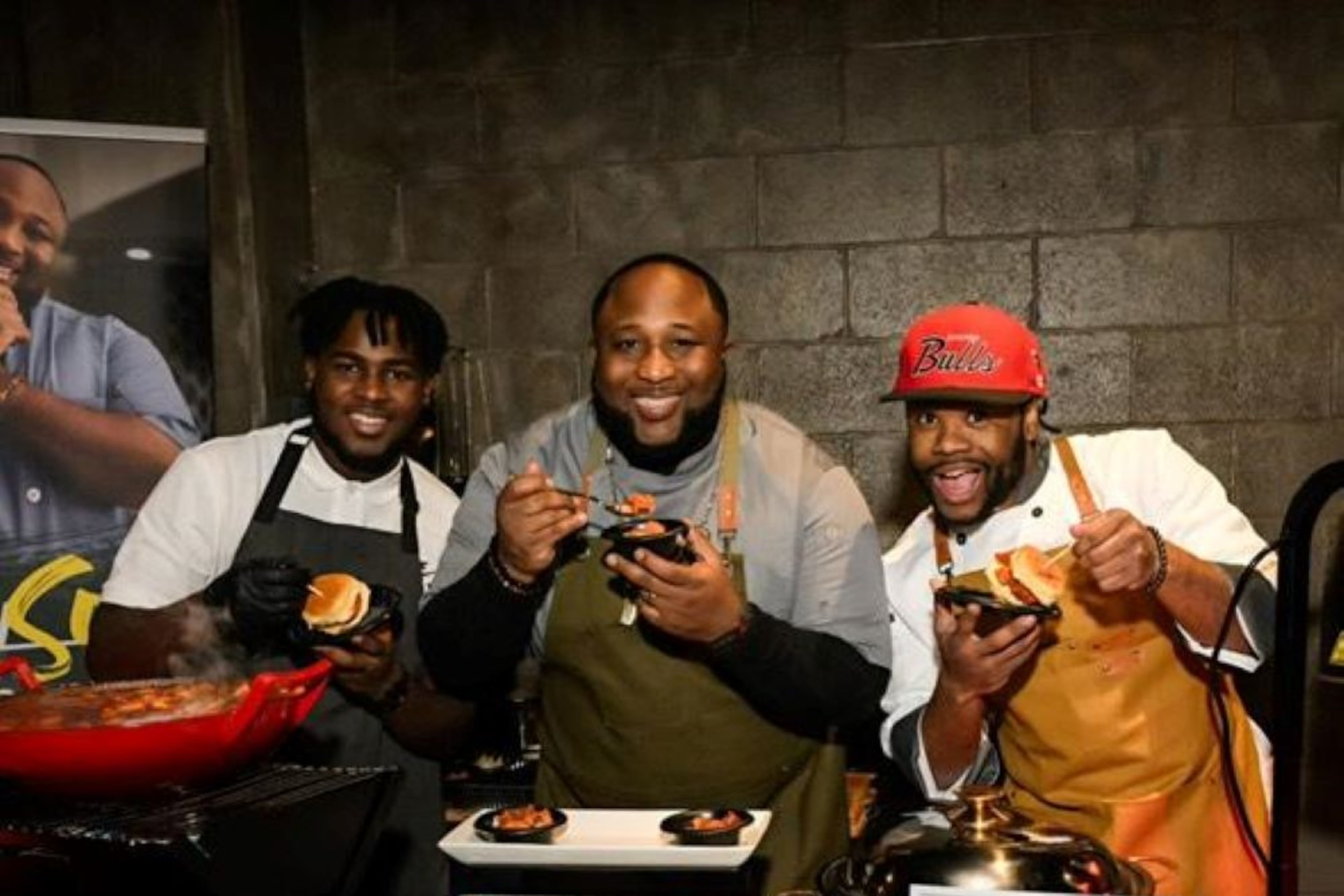 Keenan Wells (left to right), Chef Jernard Wells and Cory "Chef Romance" Hinton host a station at Recording Academy-Atlanta Chapter nomination party on January 25, 2023 at The Loft in Atlanta. (Courtesy Cory "Chef Romance" Hinton)