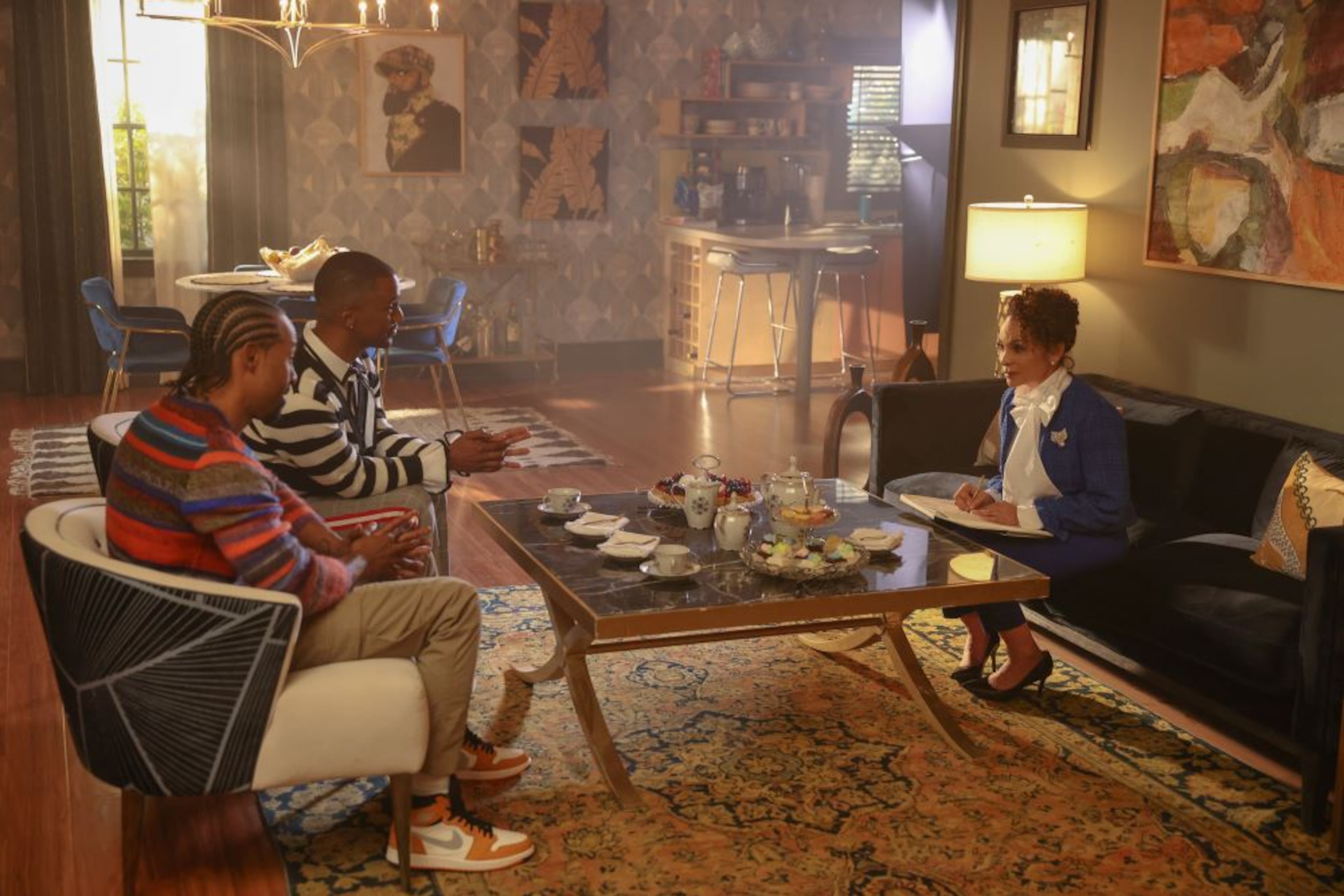 From left to right, Jensen Atwood (Wade), Darryl Stephens (Noah) and actress Jasmine Guy in a scene from "Noah's Arc: The Movie." (Matt Miller/Paramount+)