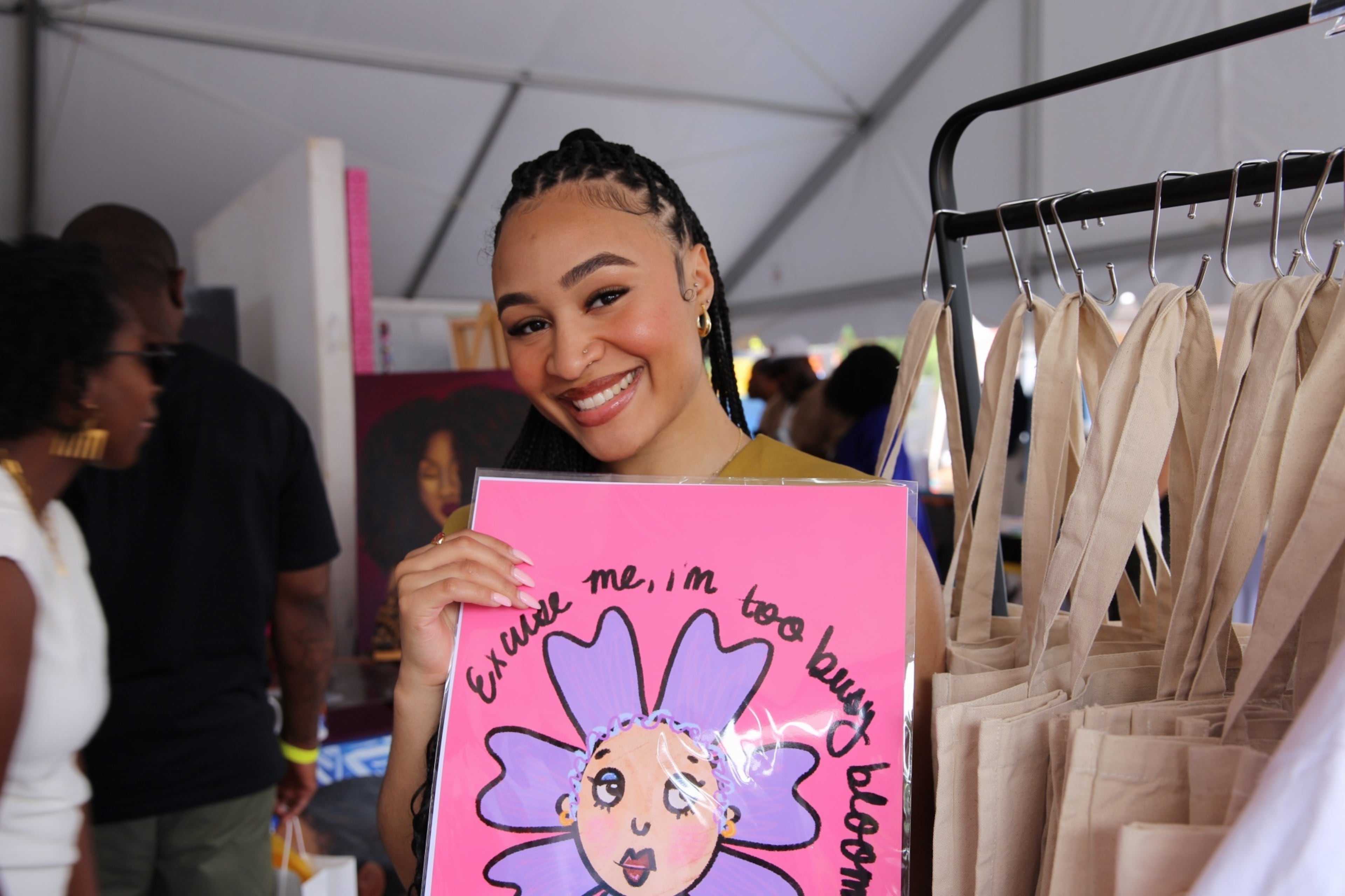 Nia Lewis, one of the featured art vendors at Blavity Fest, connected with the event through the Black Girl Art Show, which opened the door for her to showcase her motivational artwork in the Black artist Pop-up Gallery within the vendor area. (Zaire Breedlove/AJC)